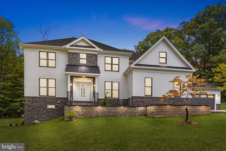 Step into luxury at 3195 Pennypack Rd, a 5-bed, 5-bath stunner on a 1.55-acre picturesque lot nestled on a quiet street. Located in Upper Moreland Twp, this property offers easy access to shopping, restaurants, highways & the YMCA. It's just steps from the Pennypack Trail for running/biking/hiking & Mason's Mill Park where you'll find picnic areas, playgrounds, & sports fields/courts. This modern estate was built in 2023 & spans 4,563 sqft plus add'l  850 sqft of finished space in the W/O basement. This property has been exquisitely upgraded & meticulously maintained with  attention to every detail, the perfect combo of luxury, comfort & convenience. Ascend the long private driveway, you’ll be amazed by the outstanding curb appeal & curved walkway with path lighting leading to the covered front porch. Step inside the double doors & be greeted by an open-concept floor plan, sun-filled rooms & neutral color palette. The entire 1st level boasts 10-ft ceilings, 9-ft interior doors, custom moldings, sleek 9" base trim, sustainable luxury vinyl flooring & recessed lighting. Flanked on either side of the impressive foyer are the formal living & dining rooms, both spacious & detailed with coffered ceilings. Continue to the impressive 2-story high family room with a wall of windows & gas fireplace. The dream kitchen features solid wood cabinetry, neutral quartz countertops, huge center island accented with pendant lighting & waterfall edge, subway tile backsplash, top-of-the-line appliances & huge walk-in pantry with add'l cabinetry & shelving. The oversized breakfast area features glass doors leading you to the beautiful outdoor living space on the 30x16 paver patio with sitting wall overlooking your backyard wooded oasis. Tucked behind the kitchen is a generous mudroom with built-in bench, shelves & coat closet. Additionally, there is a bonus room on this level that could be used as a first-floor bedroom suite, office, or playroom, & even has an attached full bath with custom floor to ceiling tile, frameless shower & lighted mirror. Make your way up to the 2nd level & check out the view from the balcony overlooking the main living area down below. The same solid surface flooring on the 1st level runs beautifully upstairs & throughout as well. Enter the double doors of the impressive primary bedroom retreat & be amazed. The sizable main area has a coffered ceiling, recessed lighting & ceiling fan. There are two walk-in closets in this impressive suite, both with custom organizational cabinetry & shelving, plus a center island with even more storage in one. Step through yet another set of double doors & be wowed by the ensuite bathroom with luxurious quartz tile running seamlessly from floor to ceiling. There are separate sink areas with lighted mirrors on either side, recessed lighting, custom oversized shower with frameless glass door, large soaking tub, & private water & linen closets. Down the hall are three more bedrooms, one is a princess suite with a tub/shower combo & the other two share a Jack & Jill bath equipped with separate sinks, trendy floor tile & tub/shower combo. Rounding out the upstairs is a convenient laundry room with built-in cabinetry, folding table & laundry tub sink. Head down to the newly finished W/O basement & be amazed. In addition to a huge unfinished storage area, the finished space boasts a separate room that could be used for out-of-town guests or multigenerational family equipped with private entrance, full bath with inset laundry area with washer & dryer, kitchenette with cabinetry, sink & full refrigerator, plus a main living area. Already zoned & marked on original engineers' plans is a swimming pool with deck and current owners have already run electrical lines for the future improvement. Add'l details:  3-car garage, radon mitigation system, well w/ iron filter/softener/UV disinfection light, 120V EV car charge line & add'l 100AMP breaker, & dual-zoned HVAC system. This home has it all!