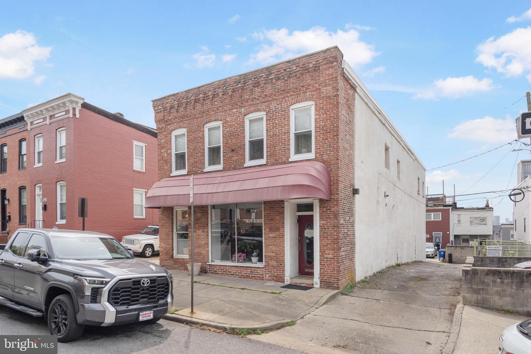 Excellent opportunity to own a rarely available detached building consisting of 3650 sq ft mixed use retail/residential space. The first floor consists of a former beauty salon. The second floor is a 2 bedroom 2 bath apartment with an open floor plan including a large kitchen island with granite countertops, hardwood floors and ceramic tile. Newer furnace and newer water heater. The units are separately metered. Buyer to verify zoning requirements. Lots of possibilities!!