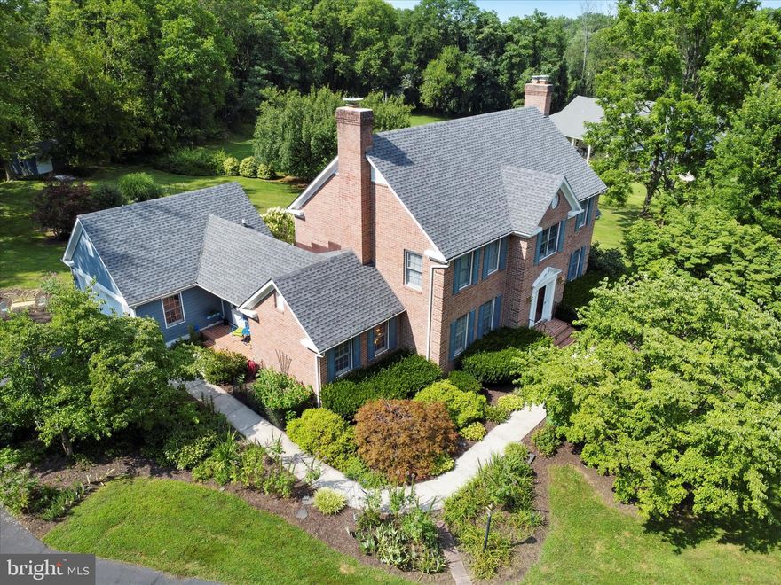 This stunning mostly all brick Colonial offers over 4,000 finished square feet of living space. Nestled on 1.41 acres and backing to trees for added privacy, located in a quiet cul-de-sac, the home boasts extensive landscaping, a paved driveway, and a 2-car garage. Relax or entertain on the large back deck, perfect for gatherings with friends and family. Inside, you'll find 4 generously sized bedrooms, 3 full baths, and 1 half bath. The expansive eat-in kitchen features beautiful built-in cabinetry and flows seamlessly into a formal dining room—ideal for hosting. The main level offers two dedicated office spaces with built-in cabinetry, a large mudroom off the covered side porch, and multiple living areas with timeless colonial charm. An additional shed in the backyard provides convenient storage.  This well-maintained home features numerous recent updates, including a roof replacement and air purifier installation in 2019, a new hot water heater in 2023, and both a new sewage pump and sump pump installed in June 2023. A new washing machine was added in April 2023, and the basement received new carpet and padding in 2019. This home combines space, comfort, and functionality in a peaceful, sought-after location—don’t miss the opportunity to make it yours!