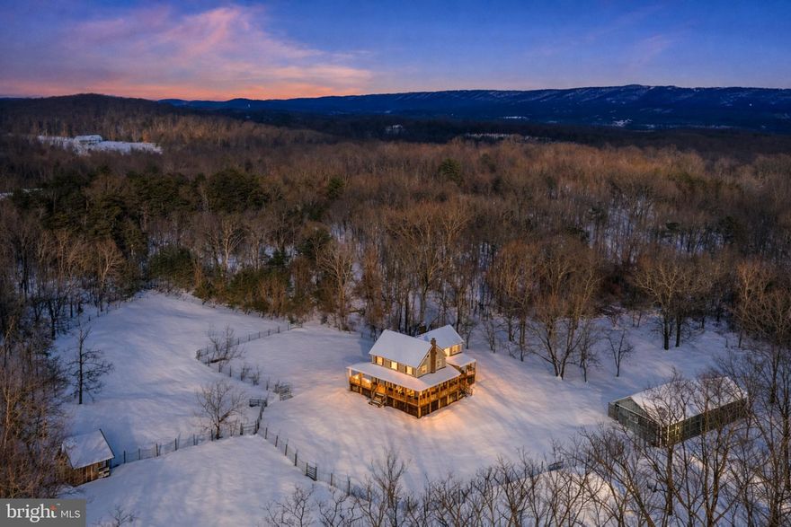 Escape to your own private West Virginia retreat at 344 Tub Run Hollow Rd, where a newly renovated home, wrap-around porch, and approx. 43 acres of land create a truly one-of-a-kind property. Tucked at the end of a quiet country lane, this setting offers the peace and privacy you’ve been looking for, with room to live, play, and dream big.
The home has been thoughtfully updated, blending modern comfort with timeless country charm. Inside, you’ll find warm, inviting living spaces with fresh finishes, abundant natural light, and an easy flow that works for everyday living and entertaining. Multiple bedrooms and baths provide flexibility for family, guests, home office, or hobby spaces.
Outside, the amazing wrap-around porch steals the show—perfect for morning coffee, evening sunsets, or simply listening to the sounds of nature. Just beyond the home, a huge outbuilding offers endless possibilities: garage parking, workshop, equipment storage, hobby space, or a combination of all four.
What truly sets this property apart is the land. The sale includes three separate 10± acre lots in addition to the main homesite, totaling roughly 43 acres. Enjoy trails, hunting, riding, gardening, or exploring your own woods, with potential for future additional homesites or a family compound (buyer to verify with county). The gently rolling terrain, mature trees, and open areas create a beautiful, usable landscape.
All of this is located in desirable Berkeley County, offering that “away from it all” feel while still being within a reasonable drive of amenities, Martinsburg, and commuter routes.
If you’ve been searching for a move-in ready home with a huge outbuilding, incredible porch living, and serious acreage, 344 Tub Run Hollow Rd is a must-see.