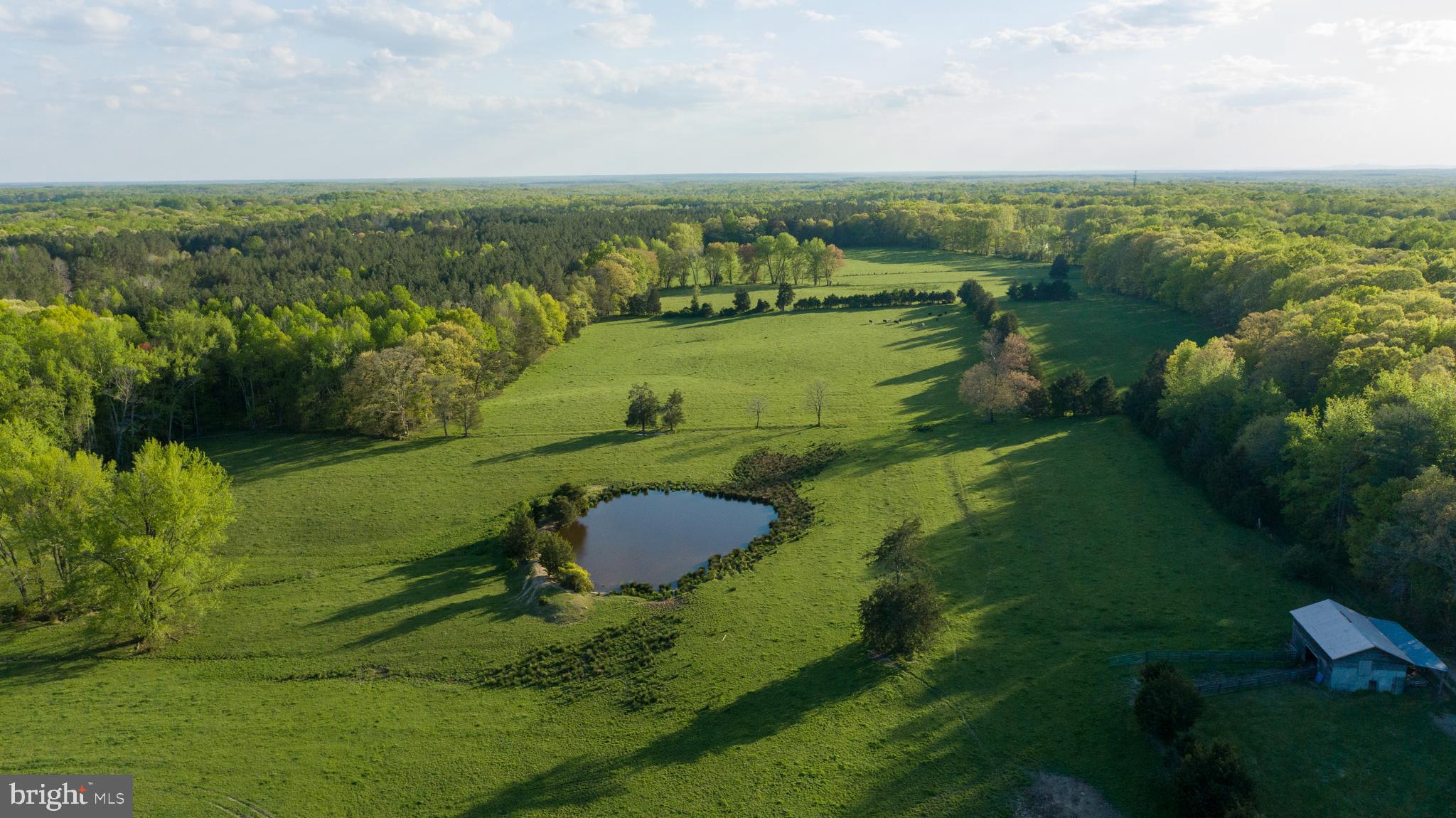 A combined 110 acres: 96 acres off Hartwood Road - TAX ID: 25-46 and 14 acres off Storck Rd - TAX ID: 25-34E. Property is made up of open pasture and 60-year-old hardwoods located in the middle of the sought-after community of Hartwood. The property has gently rolling topography, easy access from Hartwood Road and two ponds at the front and middle of the property. The property currently has several outbuildings on site with access from the established gravel driveway. The property is located just a short drive from Curtis Park. Currently leased and used as a farm, seller makes no warranty on old homes, buildings or utility on lot. Property has survey, no soil/engineering or other studies are available. Buyer to verify all information/due diligence. Do not enter small white abandoned home - as-is condition.