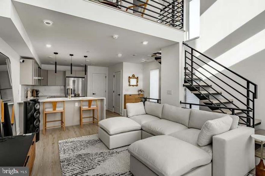 Welcome to Hagert Street Estates, Fishtown’s newest luxury townhome development. This stunning 3-bedroom, 2.5-bath bi-level townhome blends modern design with high-end finishes and thoughtful details throughout.

The upper level features soaring 16-foot ceilings that flood the main living space with natural light, creating an airy, expansive feel. A floating staircase makes a striking first impression upon entry, while the sleek kitchen is outfitted with Samsung stainless steel appliances. Just off the main living area is a secondary living space that overlooks the first floor, perfect for a home office, lounge, or flex space.

Enjoy private outdoor space including an expansive private roof deck with unobstructed skyline views. Additional highlights include optional gated parking and bespoke finishes throughout.
Ideally located within walking distance to Fishtown’s most popular cafés, restaurants, and shops, with easy access to I-95, I-676, and Philadelphia International Airport.

PARKING INCLUDED IN PRICE AND IS SEPARATELY DEEDED IN GATED LOT BEHIND HOME!

8 YEARS LEFT ON THE TAX ABATEMENT!!