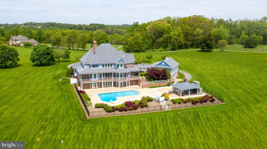 Potomac Estate Grandeur, closer to the major amenities....Make this Germantown, MD, beauty yours! It's 30 miles from the Capitol building in DC. The 5+ bedroom , 4.5 bath house sits on 13+ acres (two additional, also for sale, lots would boost your enclave to 85 acres), so you could ride horses in the day then go to The Kennedy Center for a show at night. 34 miles to National Airport, 38 to BWI, and 38 to Dulles. Close to 3 major airports and Washington DC, this house is an escape from everything yet close to everything. Just over 5 miles to the Clarksburg Outlet Mall, 2 miles to Home Depot, Wegmans, Best Buy, Office Depot, DeMarco Italian, Panera, Giant Foods, Target, Kohls and just a stone's throw from Butler's Orchard and so much more! It boasts a full home theater, card room, sound studio, gourmet kitchen, 20 meter pool, 6 person hot tub, outdoor gourmet Viking appliances kitchen and bar w ice maker, out door gas fire place, entertainment center, whole house entertainment and music center.  Take the tour ! It's available for in person showings by appointment! If you want a home that's secluded and also very accessible, this is it.