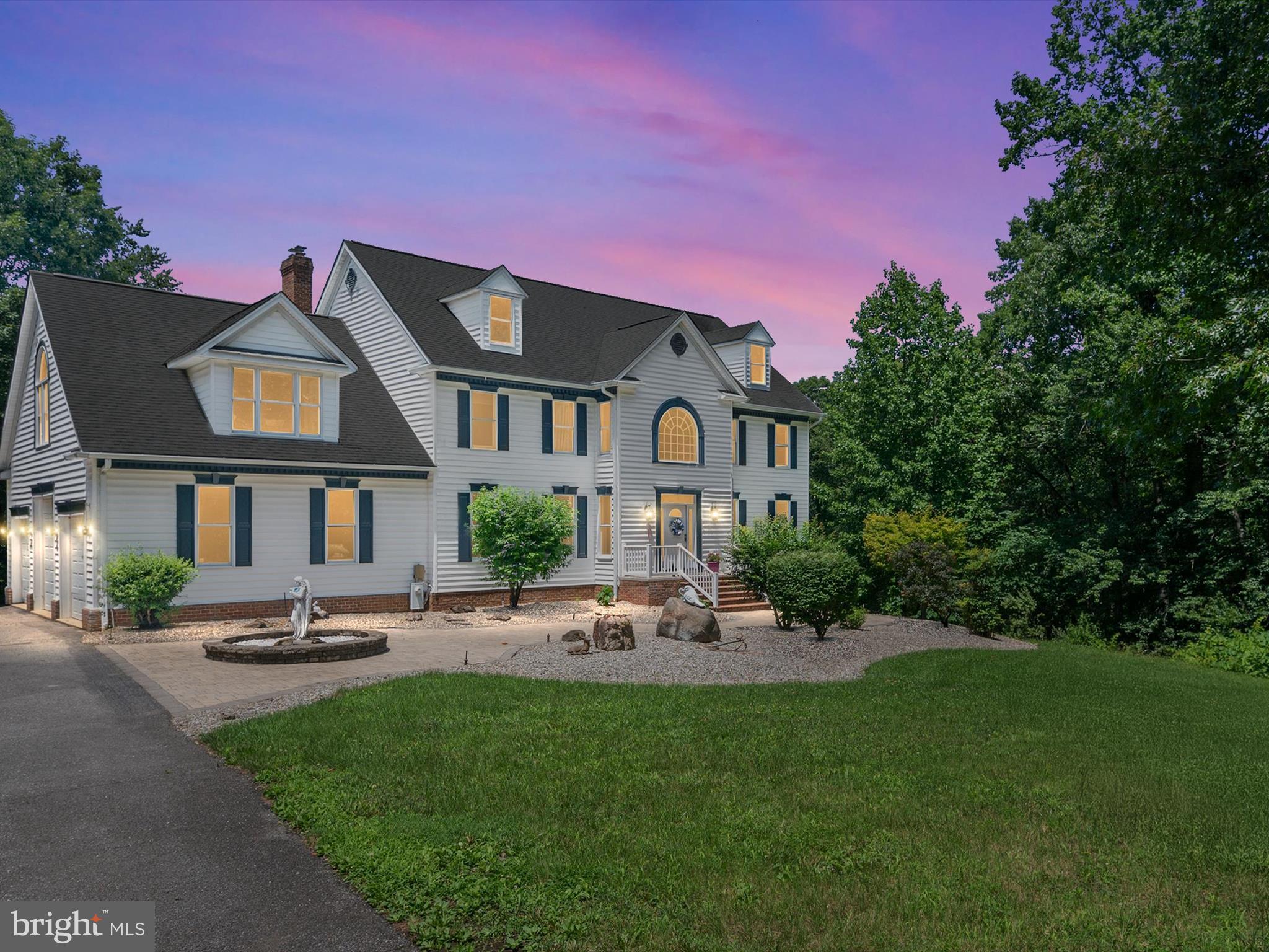 Experience the perfect blend of luxury, privacy, and natural beauty in this exceptional Crownsville home. Nestled on over 10 serene acres, mainly wooded yet walkable with trails and stream, this property offers a rare opportunity to enjoy peaceful living just minutes from major conveniences.
The main level showcases gleaming hardwood floors, a dramatic two-story foyer with a palladium window, and flexible living spaces including a sunken living room with a cozy fireplace, and a main-level bedroom or ideal office/library. The heart of the home is a gourmet kitchen featuring a 5-burner downdraft cooktop, stainless steel appliances, granite countertops, recessed lighting, a center island with breakfast bar, and a walk-in pantry. Separate formal living and dining rooms are bathed in natural light and adorned with elegant tray ceilings. Upstairs, you'll find four generously sized bedrooms, including a luxurious primary suite with hardwood flooring, a spacious walk-in closet, and a beautifully updated en-suite bath with soaking tub, separate shower, wide dual-sink vanity, and custom tile. An equally impressive renovated hallway bath features dual granite vanities, an oversized glass-enclosed shower with mosaic and subway tile, and stylish finishes throughout. A true highlight is the expansive bonus recreation/game room — complete with billiards, bar, lounge, and TV area — and everything in this room conveys!
The lower level offers over 1,800 sq ft of potential: a 14' x 7' alcove perfect for a future wine room and a rough-in for an additional full bath, providing endless customization options. Step outside to your own private retreat with a spacious deck, gazebo, hot tub, and a dedicated basketball court — all surrounded by the tranquility of untouched natural landscape.