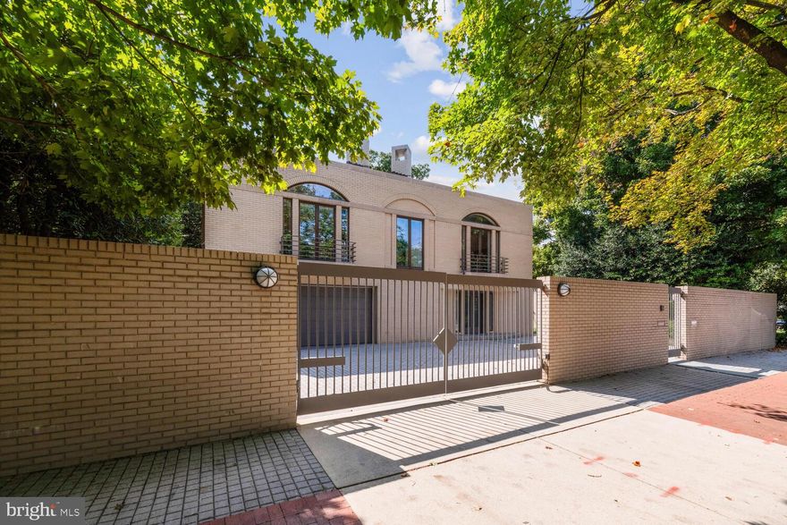 Significant Price Reduction Again!! Located on one of the prettiest streets in Georgetown, this unique brick home is detached and situated on a 9102 SF lot suitable for 7+ car off street parking. A contemporary flair designed by architects Wilkes, Faulkner, Jenkins and Bass defines its presence. The elegant entrance leads up to the main living level. The library, main hall, dining room, kitchen and master bedroom look out onto a beautiful, private terrace and fountain. The lower level features two bedrooms, two baths, kitchenette, storage and utility rooms and two car garage. The top floor includes two additional bedrooms and a delightful covered balcony overlooking the lap pool and backyard.