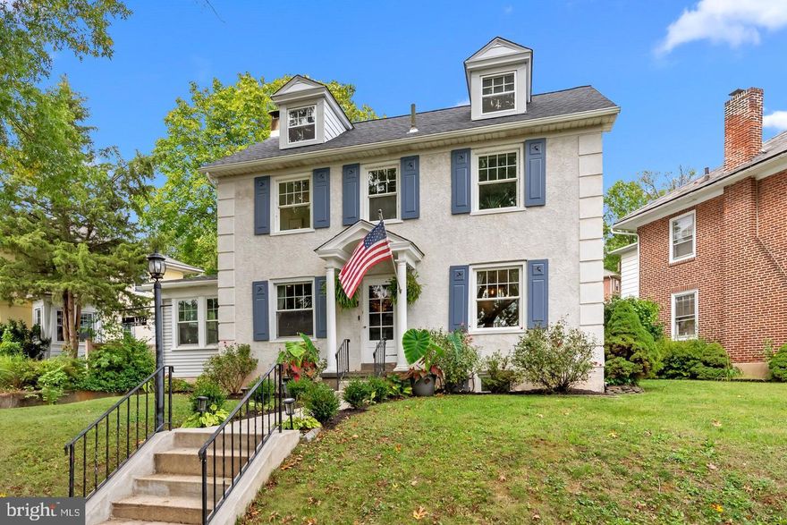 Experience the perfect harmony of old-world elegance and forward-thinking sustainability in this beautifully maintained Colonial, tucked away on a serene, tree-lined street in Montgomery County.  From the moment you arrive, the classic stucco exterior and lush, professional landscaping hint at the retreat within. The main level welcomes you with an inviting living room anchored by rich hardwood floors with decorative inlays, an oak staircase, and a cozy pellet stove set against a classic wood mantel.  Bathed in natural light, the adjoining sunroom serves as a tranquil escape with its wall of windows and custom built-ins. Flowing through elegant French doors, the heart of the home is a chef’s dream: a remodeled kitchen featuring sophisticated 42-inch cabinetry, premium stainless-steel appliances, and expansive counter space designed for effortless entertaining.  The transition to outdoor living is seamless, leading you to a private, fenced-in backyard that feels like a tropical oasis. Whether you are hosting a summer gathering on the covered deck or relaxing on the patio amidst the verdant greenery, this space offers a rare level of seclusion and charm. Upstairs, the home continues to impress with three spacious bedrooms and a spa-inspired bathroom finished with a deep soaking tub, stall shower, and double sinks. A unique second-story deck provides an elevated vantage point to enjoy views of the lush grounds below.  Beyond its aesthetic appeal, this home is a model of modern efficiency. It is entirely free of fossil fuels thanks to a recently installed energy-efficient split A/C and heating system (2023) and a new water heater (2023). With a roof replaced in 2021 and a lower level that provides a finished bonus area, workshop, and ample storage, every detail has been thoughtfully addressed. Situated just minutes from local libraries, boutique shopping, and major commuter routes, this residence offers a sophisticated, eco-conscious lifestyle without compromise.