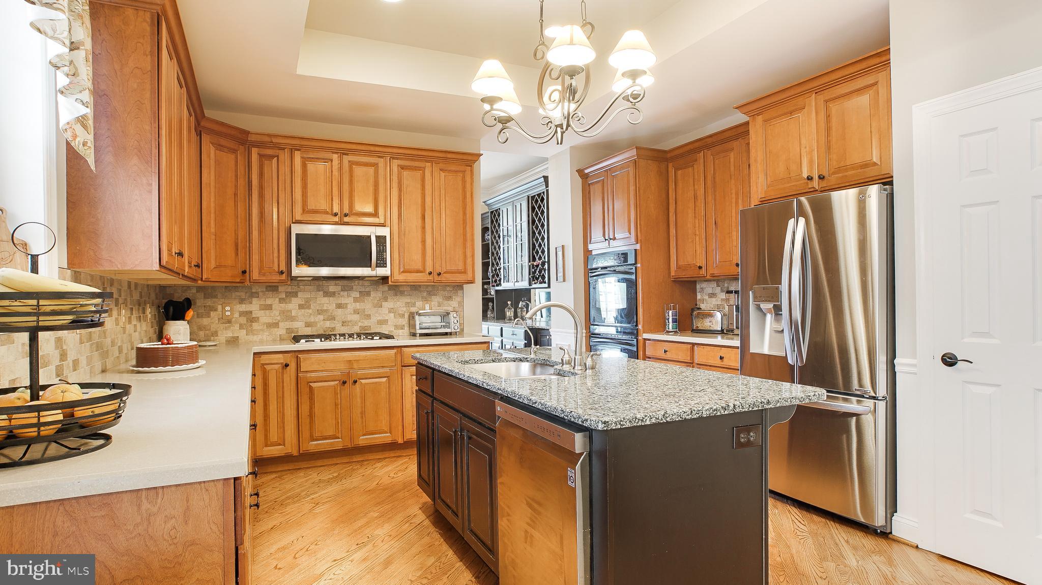 Welcome to the development of Cherry Creek community featuring 80 acres of protected open space along with miles of walking trails, sidewalks, natural wetlands. This absolutely stunning luxury Carriage home with its many upgrades and open concept will not disappoint. Upon entering into the charming gated entrance, with custom pavers, this courtyard allows abundance of sunlight throughout the homes many rooms. Once inside the home, you will be impressed with the many upgrades. Enjoy the beautiful hardwood floors, dining room with open concept, custom trim work, chair rail, crown molding and spectacular wet bar with wine racks, glass cabinet doors, decorative shelving and extra cabinet space. The living room with it comfy feeling offers crown molding, see thru fireplace, and plenty of natural light from the large windows. To the other side is the family room with access to the oversized composite deck. The best room of all the kitchen with its endless 42 cabinets, 2 pantry closets, new stainless-steel appliances, double oven, gas stovetop, granite counter top island, solid surface counter tops and gorgeous back splash. Upstairs enter through the double doors to the massive Master bedroom suite, with additional area that can be used for many things, office, nursery, workout area, the possibilities are endless, two large walk-in closets and an impressive master bathroom with soaking tub, double sinks and a water closet. Down the hall pass the inviting sitting bench with a wall of windows to the courtyard below, awaits two very spacious bedrooms, one with a bay window and large hall bathroom. Lower level will not disappoint with its finished sitting area, room for additional office area. 4th bedroom with glass sliders to a patio out back and full bathroom completes the finished area. But don t miss the abundance of storage available. Property is located in the highly sought out West Chester School District. New HVAC system installed in 2018. HOA fee includes: Common Area Maintenance, Lawn Care in front & rear, Lawn Maintenance, Snow Removal. Convenient access to Routes 202, 322, and Rt.1 and within close proximity to the West Chester Borough, offering many dining and shopping options. This home will not disappoint!! Schedule to see this one today!