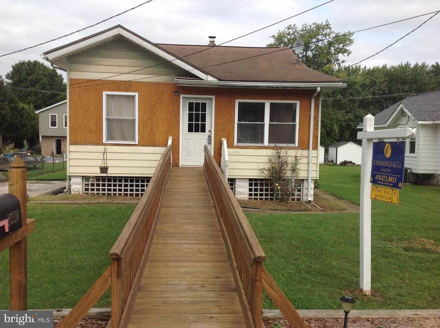 Home is in need of full renovation.  2 bedrooms on main level. Fixed stairs to unfinished attic has potential for additional rooms. Basement is completely dry, and has been for many years!!!! Owner had done extensive work on walls to water proof in addition to french drain and sump pump.  There is a usable flush in the basement and a shower head installed but no walls to enclose it. Many windows have been replaced and electric updated several years ago. *** The price of this house includes a separate lot to the back, that with a variance could possibly be another residence. It has a separate address of 315 Shore Rd and a separate tax bill. ***** Information is included under documents **** These two parcels will not be sold separately. This is an Estate Sale and is strictly sold " AS IS "