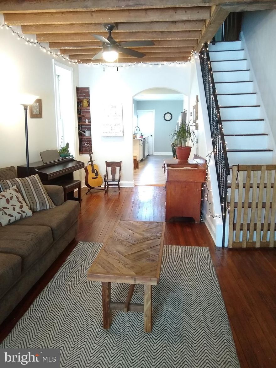 This recently updated end row home features an enclosed porch for easy bike storage and a remodeled kitchen with granite countertops and a suite of GE Slate appliances including a 5 burner gas stove. An exposed beam ceiling, featured brickwork, hardwood floors, and rustic built in shelving with accent lighting contribute to the charm of this three bedroom home. The basement offers plenty of storage including an additional room. Samsung front load washer and dryer in basement along with new HVAC system and new water heater. Electric, plumbing, and gas lines all recently replaced. Back patio offers enough space for grilling and even a small raised flower bed. Comfortable street parking with close proximity to neighborhood park with swimming pool. Easy access to route 95 and public transit. Come home to this great block and enjoy all that Port Richmond and the surrounding area has to offer.