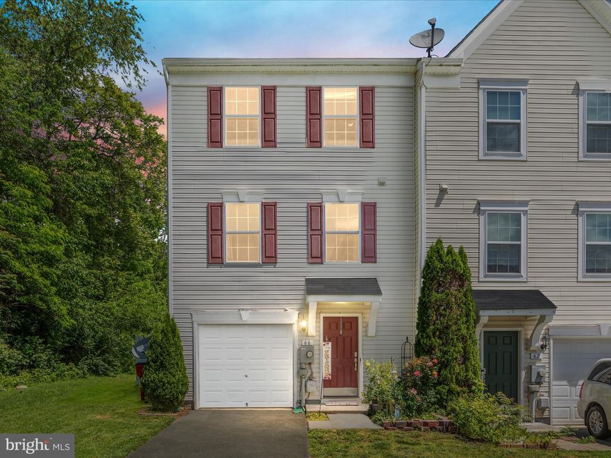 This spacious End Unit, 3-story townhome features a 1 car garage, 3 bedrooms, 2 full bathrooms and 2 half baths, offering over 2,200 total finished square footage of comfortable living space.  Additionally, the home includes a 12 x 16 composite deck, paver patio below, and vinyl privacy fencing which completes the outdoor entertaining space. The kitchen boasts a center island, stainless steel appliances, with ample cabinet space and luxury vinyl plank flooring on the entire main level. The morning room off of the kitchen along with the family room are perfect for relaxing or entertaining friends. Upstairs, the primary suite features enough space for a king-sized bed, a walk-in closet, along with a lovely bathroom with a soaking tub and separate shower. Two more adequately sized bedrooms and a second full bath complete the upper level.   Conveniently located in Hedgesville, this home offers easy access to local amenities, parks and recreation, and commuter routes, ensuring a lifestyle of comfort and convenience.  Schedule a showing today!