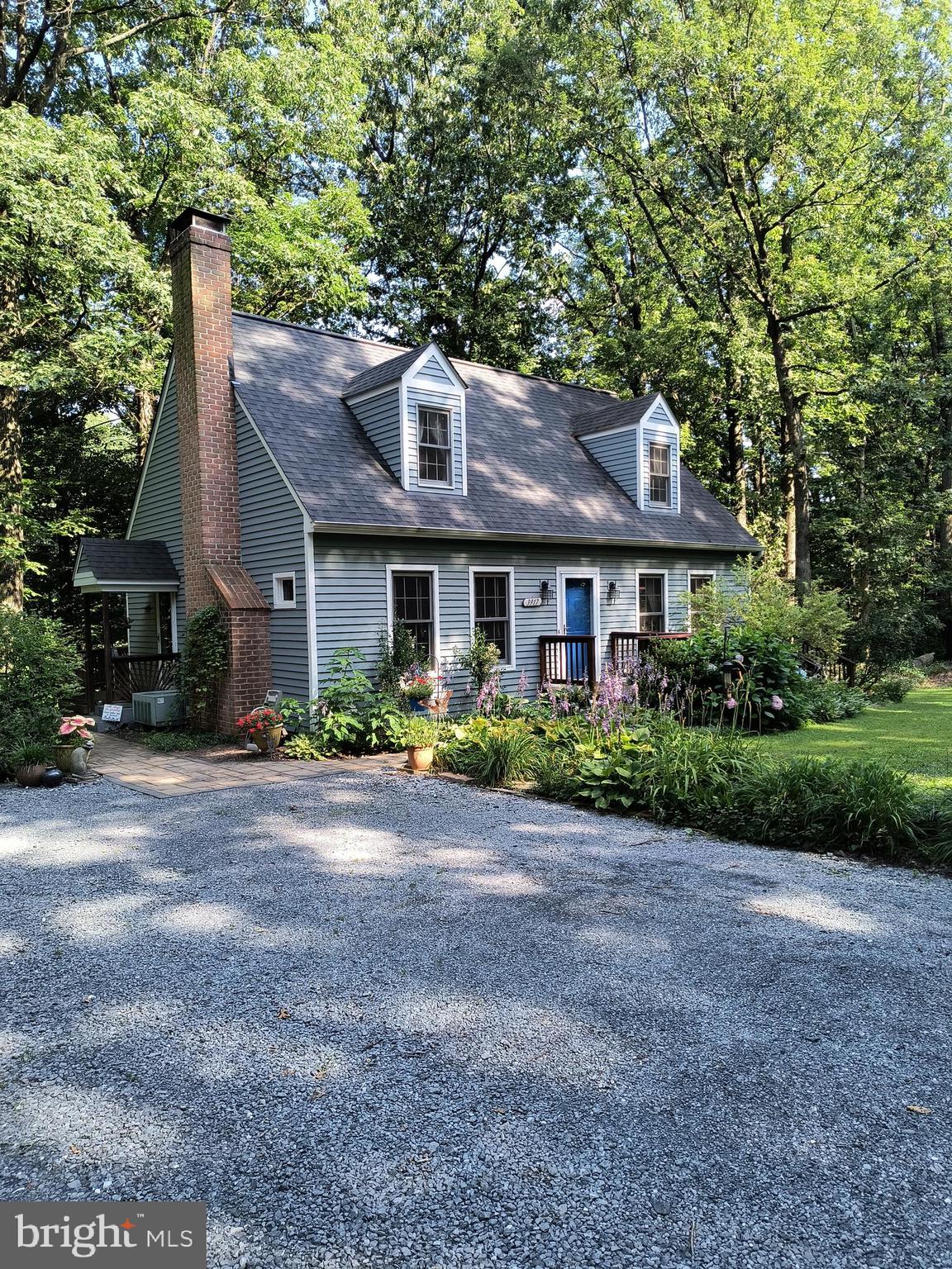 Welcome home to this Lovingly Maintained Cape Cod Nestled Among the Shady Oaks Along Basford Rd. A 1.45 ac Private Retreat. Move-In Ready, Fresh Modern Paint, Rich Hardwood Floors, Plush New Carpet. Relaxing Living Room w/Built in Shelves and Wood Stove. Open Dining Room, Glass Slider to the Screened Porch where there is Space for Dining and Entertaining. Also Leads to wrap around deck w/Approved Area for a Hot Tub. Main Level Master Bedroom (currently used as den) with En Suite, Recently and Tastefully Renovated. Well Appointed Kitchen is Stylish and Efficient. Upstairs are 2 Generous Sized Bedrooms w/Fresh Paint and New Lush Carpet Along with a Second Contemporary and Newly Renovated Full Bathroom. The Lower Level Offers Walk Out Egress. Loads of Storage Space OR Could Be Finished the Way You Like it. Steps up to the Driveway where there is parking for 4 cars Just to the Side of the Home But there is Space Enough to Park 10 More Cars or Your RV and Outdoor Toys Just Down the Meandering Path Through the Perennial Gardens and Past 3 Storage Sheds for your Indoor Toys. Picturesque Level Front and Side Yards. Conveniently Located to Routes 15 x 340 and Marc Train. NO HOA!! All Furnishings on Main Level and Upstairs can Convey.