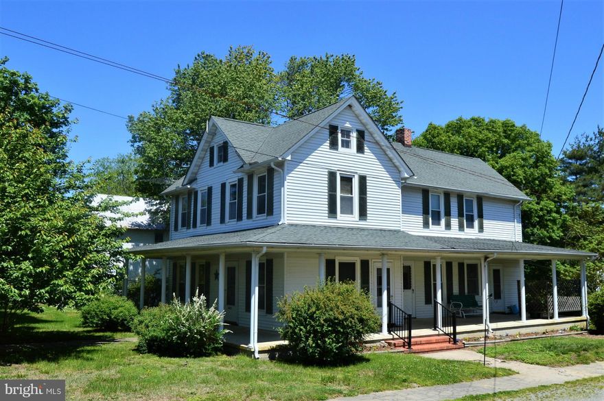 Spacious, well maintained farmhouse on large corner lot...4 bedrooms, 2 full baths, eat in kitchen w/ lots of cabinets & over sized pantry, dining room, living room, hardwood floors, beautiful wrap around porch, detached 2 car garage, nicely landscaped w/ mature shade trees, newer roof, windows & vinyl siding, just steps away to community park & walking trail....Motivated Seller