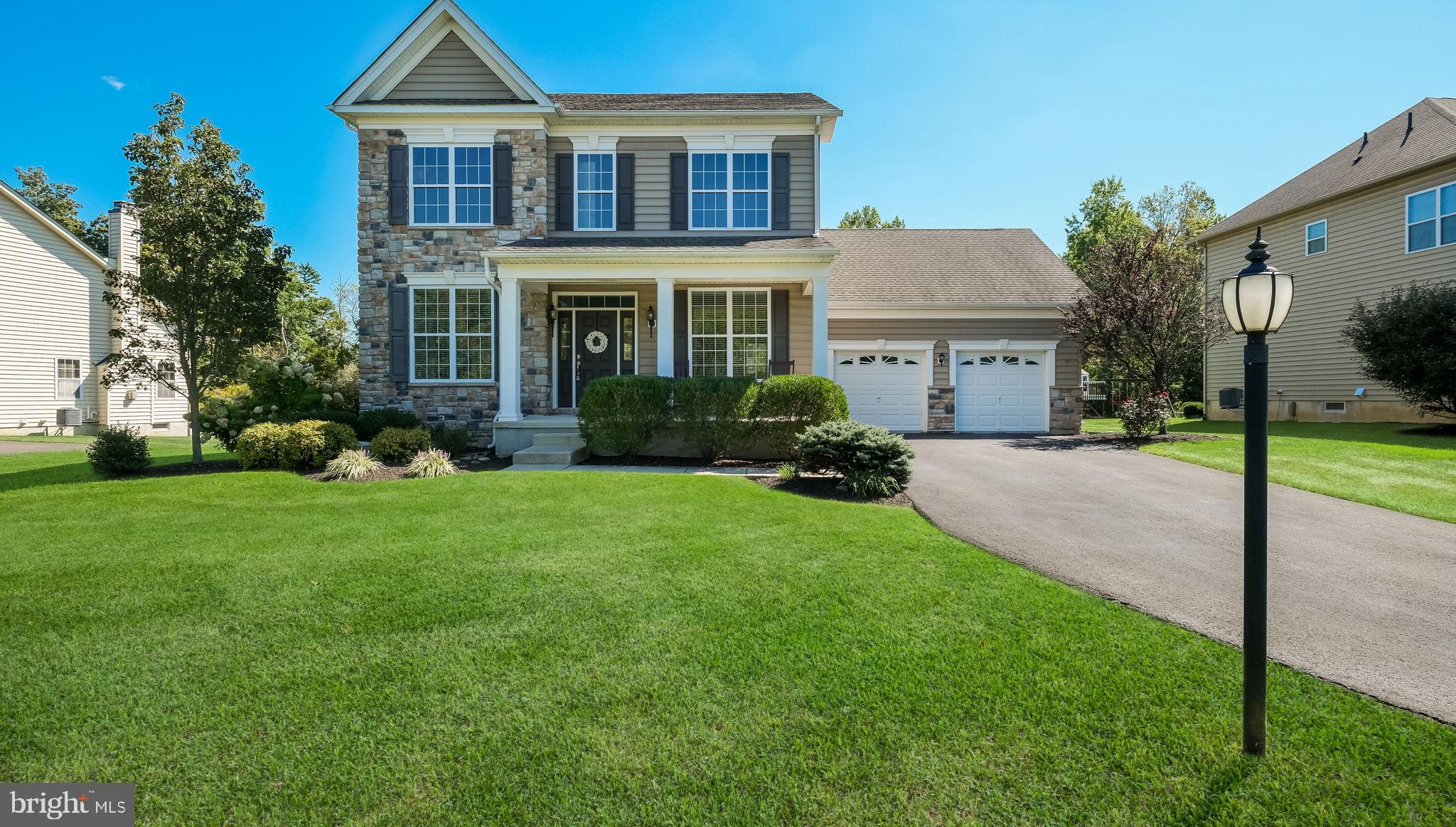 Welcome to your dream home in the highly coveted community of Plumstead Woods. Located at 5068 Kratz Carriage Road, this exceptional 4 bedroom, 3.5 bath home offers the perfect balance of comfort, functionality and modern design. Beautifully situated in an elegant and serene neighborhood this meticulously maintained home is truly move-in ready. From the moment you arrive you, you’ll be be captivated by the home's charming curb appeal and tranquil surroundings. Step inside to find a thoughtfully designed interior, highlighted by gleaming hardwood floors throughout the main level and continuing into the spacious primary suite. The main level consists of a formal dining room with chair rail and crown molding, a versatile office/playroom is perfect for remote work or as a creative space for the kids, complete with a tiled full bathroom. The gourmet kitchen is a chef’s dream boasting a large island, 42” cabinets, a 5 burner gas cook top, an abundance of cabinet and counter space, pantry and stainless steel appliances. The extended breakfast area is bathed in natural light and overlooks the backyard, flowing seamlessly into the adjoining great room with a cozy gas fireplace ideal for cozy evenings with family and friends. Upstairs, the primary suite offers a true retreat, featuring a tray ceiling, a large walk-in closet and a luxurious en-suite bath with a soaking tub, separate shower and double vanity. Three additional generously sized bedrooms are found on the second level, two of which have walk-in closets. A beautiful tiled bathroom completes this level. The lower level of the home includes a partially finished basement providing a versatile space for a recreation area, home theater or gym and plenty of additional storage. Enjoy the beautifully landscaped backyard with a two-tier paver patio perfect for alfresco dining or hosting summer gatherings. The front porch adds additional curb appeal while offering a relaxing spot to enjoy the neighborhood. Additional features of this beautiful home includes a 2 car garage with additional storage space, a tiled laundry room with laundry sink, recessed lighting, 9’ ceilings on both the 1st and 2nd levels, a whole house water filtration system and a whole house generator for year round peace of mind. This exceptional home is ideally located just minutes from top-rated schools, scenic walking trails, local parks, major commuting routes and the vibrant downtown of Doylestown for shopping and dining. Don’t miss this rare opportunity to own a turn-key home in one of the area’s most desirable neighborhoods.