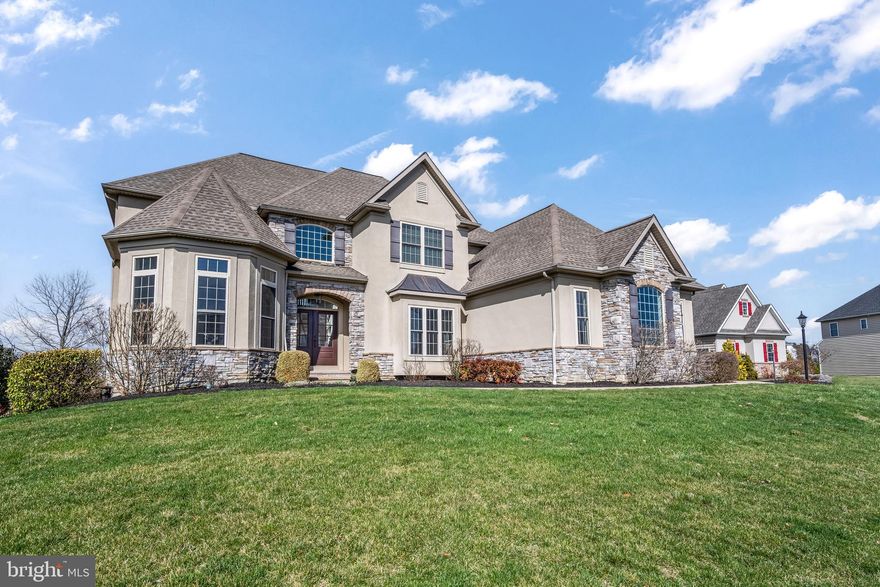 Welcome home to this stunning 5 bedroom 4.5 bath property with over 5500ft of finished space.  Pride in ownership is apparent with all the upgrades made to this impressive Manheim Township residence.  The finished lower level has a gym, wet bar, theatre room, full bath, and open space that leads to the impressive POOL/SPA with custom gas fireplace on the huge patio.  The main level of this home is impressive with its primary suite with a spa like bathroom, home office, formal dining room with wet bar beside it, half bath, laundry room, and huge 3 car garage.  The main attraction of the first floor is the open floor plan with cathedral ceilings, skylights, wonderful kitchen with high end appliances, a screened in portion of the trex deck, and the trex deck overlooking the resort style backyard pool/spa.  The second floor has 4 bedrooms with 2 full baths and a loft area at the top of the steps.  This is a must see home!