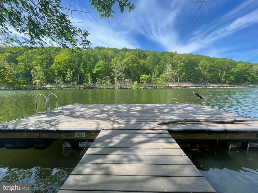 Rare opportunity to build on one of the last remaining lakefront lots in the Aspen community of Lake Linganore! This premium deep-water waterfront lot offers an exceptional setting for a custom home, with direct lake access and long-term value in a fully established neighborhood. The property is located on the deep-water side of the lake, ideal for boating, kayaking, and year-round enjoyment. A brand-new private dock installed in 2023, constructed with low-maintenance Trex decking, is already in place—eliminating permitting delays and providing immediate access to the water. This large, buildable lot offers scenic lake views, excellent frontage, and privacy, while still benefiting from planned future connectivity to the new bridge and nearby shopping center once the road connection is completed, enhancing convenience and accessibility. Lake Linganore is known for its lakes, beaches, trails, pools, and strong community atmosphere. Opportunities to purchase true lakefront land in Aspen are extremely limited, making this a compelling option for anyone looking to build now or hold as a long-term investment!