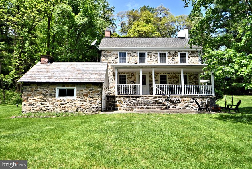 Welcome to Deer Haven Farm, where the name is very fitting for not only the deer, but all the other wildlife and humans that inhabit this 62 plus acre parcel.  As you meander along the gravel drive through the canopy of mature trees, the stress and hustle and bustle of life evaporates, and you can become one with the land. However you choose to utilize the property, for raising animals, horses, hiking,, birding, 4 wheeling, hunting this property can be home for all.  The stone farmhouse has a wide front porch, and a covered side porch to enjoy the outdoors, even in gentle rain. The huge eat in farm style kitchen is the perfect room to enjoy mealtime with those special people in your life. Next you can relax in the cozy den with a gas insert in the stone fireplace.  Around the corner is the spacious living room, that boast many windows with the wide window sills that bathe the room with sunlight and a wall with exposed stone and open beam ceiling add warmth and originality . Two stairs to the second floor, one a  curved original stairs and a second stairs from the kitchen.  3 ample size bedrooms and 3 full baths,  A walk up fully insulated attic offer plenty of additional storage. The basement hosts the laundry hook ups and other mechanicals for the home.  Extensive drainage  system installed under the floor provide a useable basement. The summer kitchen houses the fuel oil tanks for the home.  Then there are the numerous outbuildings that can be home for the car collectors, small contractors, farmers, let your imagination run.  First is the oversized 2 car garage with a second floor for additional storage. Next is the  oversized 4 bay block garage with high ceilings  complete with 2 zone oil heat, with summer winter hook-up. In addition it boasts a second floor guest suite, complete with kitchenette, full bath and laundry, ideal for guests who want to enjoy an extended stay in the outdoors with you.  Lest I forget to mention the huge 50 x 80 pole barn with  cement floor and multiple large sliding doors for easy access for large equipment.  Lastly there is a open machine shed to keep other items out of the elements, like that camper, extra vehicles, you name it, you can never have too much storage. There are 3 deer stands on the property that will remain, could also be used for birdwatching.