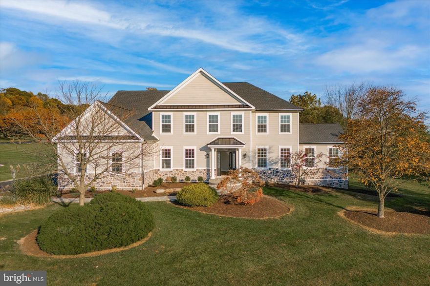 Experience incredible suburban luxury living in this exquisite Colonial home nestled on a cul-de-sac in the prestigious Wainwright at Whitemarsh! Beautifully renovated and ready for new owners, it has that welcoming vibe from the minute you roll up the driveway and walk down the stone paver walkway past the nicely landscaped yard. Step through the brand-new front door and enter a grand two-story foyer adorned with white oak brushed hardwood floors that are featured throughout the home. A bright home office with open built-in shelving sits to the left of the foyer, while a formal living room graces the opposite side. A formal dining room with wainscoting sets the stage for effortless entertaining and hosting a lavish dinner party. Off of the formal dining and living area is a large bonus sunroom with cathedral ceilings! A herringbone backsplash, quartzite counters, a large white farm sink, ample bright cabinetry, a massive 9 x 5 kitchen island, an accent butcher block countertop, wine fridge, large pantry and top of the line stainless steel appliances are just a few fantastic features in your luxury kitchen. From the kitchen, you also have easy access to the updated powder room, laundry room, and a sliding glass door opens to the paver patio, providing a picturesque view of the serene backyard. The spacious family room is directly off the kitchen with a wood fireplace, bright windows, built-in shelving, and back stairs to the upper level. Head up the beautiful front staircase with charming black spindles to the home's second level where the hallway, boasting more gorgeous wood flooring, overlooks the foyer. The phenomenal master bedroom shows off a vast walk-in closet and the luxurious master bathroom features a freestanding soaking tub, porcelain tile floor, double vanity, and a large walk-in shower with gorgeous custom tile work! The second level also houses four additional, fully carpeted bedrooms, each flooded with natural light and their own closets. One serves as an en-suite with a newly updated private full bathroom, while the remaining three share an equally impressive full jack-and-jill bathroom. Finishing off the second level is a very large hallway linen or storage closet! The basement provides an estimated 1486 sq ft of finished space, which houses a gym room, another full bathroom, and a storage area. Parking is never an issue with an oversized 3-car garage and a freshly seal-coated driveway! Know your comfort is secured with the newly installed HVAC, roof, siding, garage doors, and more! Living at 213 Sutter Lane, you are within the award-winning Colonial School District and the highly desirable Ridge Park Elementary School. Close to major roadways, transportation, malls, shops, and dining. This incredible listing is the home of your dreams!