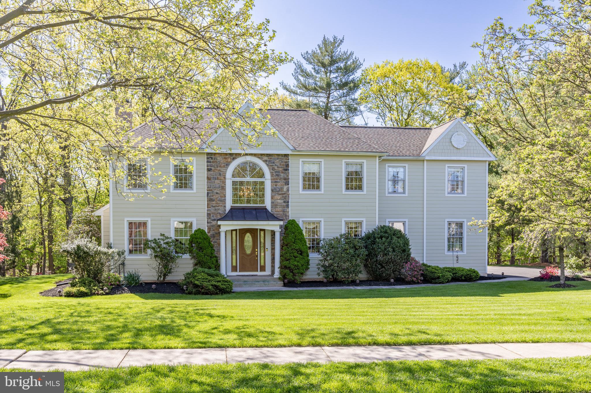Welcome to this stunning 5-bedroom, 2.5-bath single-family home nestled in one of Collegeville’s most sought-after neighborhoods. Perfectly positioned on a picturesque 1.01 acre lot, this property offers the rare combination of privacy, natural beauty, and modern upgrades. As you pull up out front you will notice the perfectly manicured grounds. The entire exterior of the home is a real show stopper whether it's the magnificent Japanese Maple trees on each side of the home or the gorgeous yard (made possible with the built-in irrigation system) you'll be proud to pull into the driveway every day when you come home. The curb appeal doesn't end there as you'll instantly notice the new Hardie Board siding on the entirety of the home with stunning Pennsylvania fieldstone accents on the front of the home and the entire chimney, all completed in 2020. As you approach the front door you'll enter the home while passing under the custom Portico with copper roof. Natural light pours into the foyer through a newly installed window over the Portico. When you enter you'll notice the gleaming hardwood floors that extend from the foyer through the 1st floor of the home. Greeting you when you walk in is a formal living room with crown molding and chair rail. If you are looking to host the holiday dinners then take a walk through to the dining room that has a thoughtful butler's pantry attached making hosting a breeze. If you are looking for a more casual dining experience the beautiful kitchen that features a center island perfect for those morning cups of coffee or a quick bite or everyone can gather around the table in the eat-in area of the kitchen. There is ample cabinet and countertop space for even the most aspiring chef to create their culinary masterpieces. Looking to unwind after a meal then head into the family room where the stunning wood burning fireplace is adorned in the same beautiful Pennsylvania fieldstone that is featured on the front of the home and chimney, there is also a breathtaking custom mantle and bluestone hearth that make this fireplace a true focal point of any room. The room is drenched in natural light and also has another exit (also one in kitchen) leading out to the recently redone Trex deck (2020) that overlooks the spectacular rear yard. There will be no shortage of space for all of your backyard BBQ's and summer parties. Head back inside and down to the massive finished basement that offers a custom built in bar with kegerator and large living space with surround sound to make game day or movie night an immersive experience. Need space to work from home? We've got that too! The basement is completed with a home office and massive unfinished space with built in shelving for all of your storage needs. Upstairs you will find a true 5 bedroom layout with large primary suite that features tray ceilings, dual walk in closets flanking a makeup/dressing vanity and large ensuite bathroom with soaking tub, separate shower and dual sink vanity. There are 4 additional bedrooms all with ample closet space and a shared hall bathroom completing this floor. This magnificent home is ready for you to move right in and enjoy everything that this amazing neighborhood has to offer. You get all this plus you are just seconds away from the Providence Town Center and 422 along with all of the great shopping and dining options in downtown Phoenixville, King of Prussia and the Limerick Outlets. Additionally, the highly sought after Spring Ford Schools are all just minutes away. Do not miss your opportunity to call this magnificent property HOME!