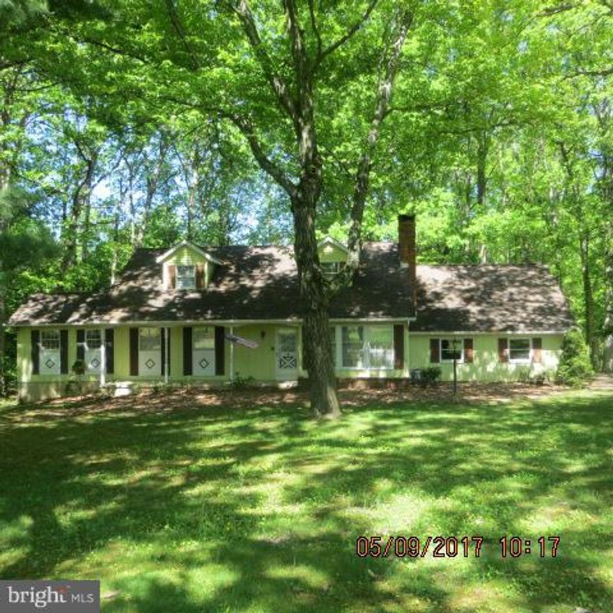 Must see this sprawling home featuring two main level BRs, an eat-in kitchen, separate dining room, cozy LR w FP and bonus main level family room. Upper level has two large BRs with tons of storage. Partially finished basement has another large family room and bonus workshop.  Property needs updating but has great potential.