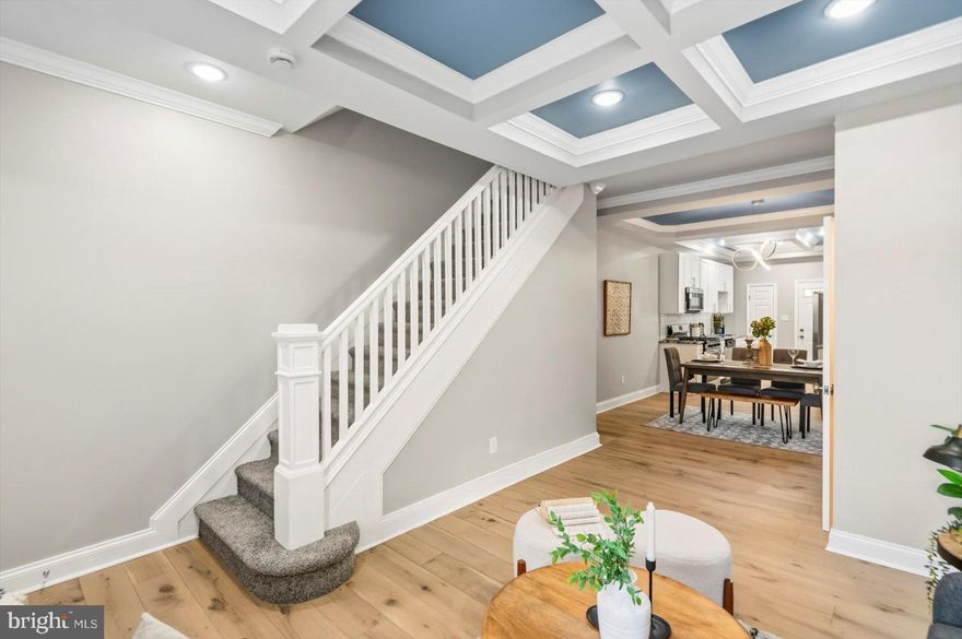 A stunning transformation has taken place behind the door of this 4BR/3.5BA Townhome located in the desirable neighborhood of Evergreen Lawn.  Make your way to the newly painted covered front porch and open the door into your forever home.  Step inside to a gorgeous main floor boasting coffered ceilings, crown moldings, recessed lighting, glamorous lighting fixtures, luxury flooring, new tons of natural light, a soft color palette, and an open floor plan.  The main floor offers a large living room, a spacious dining area, a half bath, and a beautiful kitchen.  The kitchen features plenty of cabinets, a separate pantry closet, stainless steel appliances, beautiful granite countertops with a complimenting tiled backsplash, and a deep stainless sink.  On the newly carpeted second floor are two sizable secondary bedrooms, a newly remodeled full bath, and a larger primary suite.  The primary offers tons of light, a double closet, a walk-in closet and a private en suite featuring a beautifully tiled walk-in shower. The lower level is finished, with new carpeting, offering the fourth bedroom, a full bath with a walk-in shower, a large family room, storage, laundry, and a walk-out to the fenced yard.  From the kitchen, step outside to a newly constructed wood deck with tons of room for entertaining leading to a concrete patio/parking pad.  This home is move-in ready with so much to offer new homeowners, and is located nearby shopping, restaurants, and commuter routes.