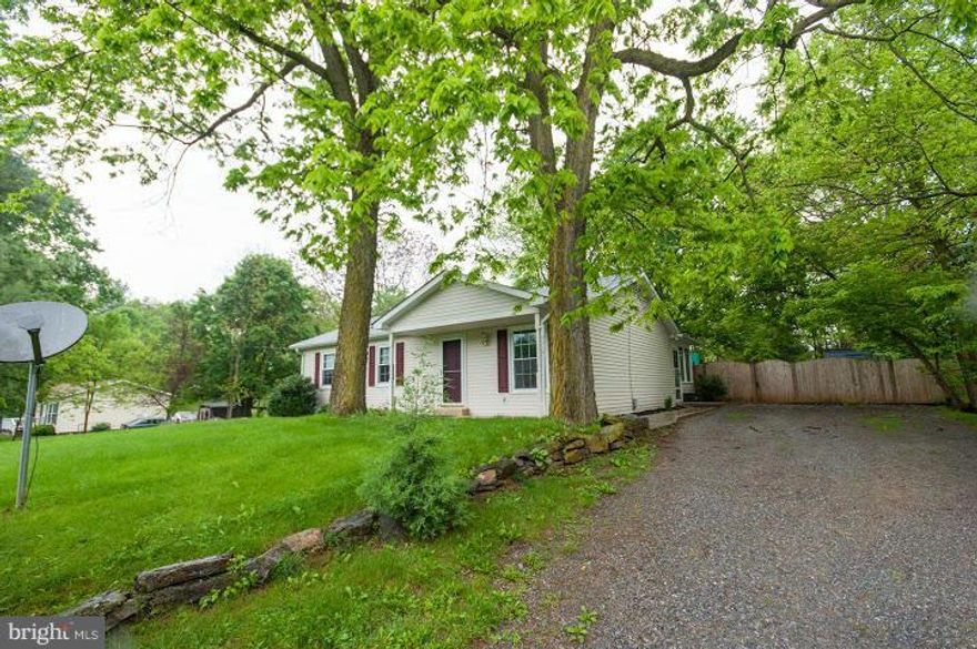 REDUCED. LET'S MAKE A DEAL. Brand new roof and freshly painted. New carpet and professionally cleaned. This is MOVE IN READY! Hardwood thru main floor. Finished walkout basement on landscaped 1/2 acre lot. Home is fenced in rear and backs to trees.  Enclosed screen porch off of kitchen extends living space. Master suite with bathroom. Full bath in basement. 1-Year Home Warranty! Don't wait!