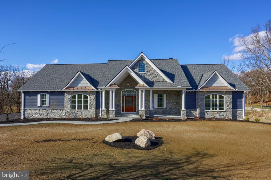 This stunning, brand-new custom rancher by Jon Warner Homes offers the ultimate in first-floor living. This exceptional, brand-new custom home, nestled in the desirable Penn Manor School District, is the epitome of modern luxury living. This expansive rancher offers an unparalleled first-floor living experience, seamlessly blending thoughtful design with exquisite features. The spacious layout includes four bedrooms, a breathtaking living room adorned with soaring cathedral ceilings, and a formal dining room perfect for elegant gatherings. The primary bedroom suite is a true sanctuary, featuring two generously sized closets and a spa-like bathroom with a luxurious walk-in shower. The heart of the home, a chef's dream kitchen, features an enormous island, ample cabinet storage, a huge pantry, and breakfast area. The large, covered porch invites relaxation and outdoor enjoyment. The finished daylight walkout basement offers endless possibilities, including a fully equipped workout/gym room, a spacious bedroom with an en-suite bathroom, a large rec room ideal for entertaining, and additional ample storage space. The backyard, with its beautiful views and potential for an inground pool, provides a serene retreat. This stunning home, situated on a sprawling 2.26-acre lot, offers the perfect balance of tranquility and convenience, with easy access to downtown Lancaster, shopping, dining, schools, healthcare, and more.