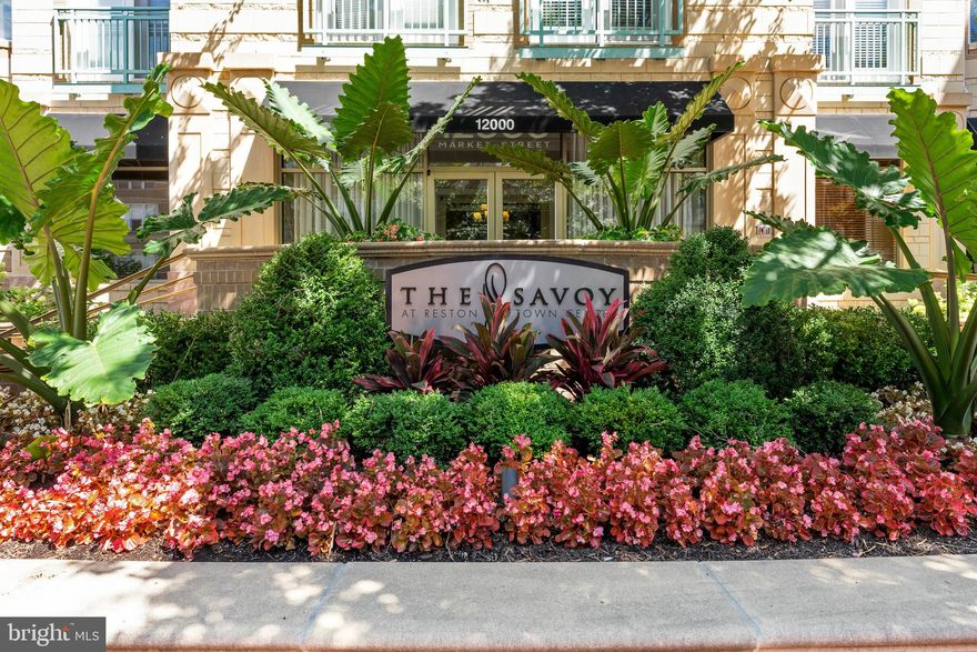 Welcome to 12000 Market Street, a prime location in the heart of Reston!                                                                              
                                                                                                                                                                                                                                                 
Step into this beautiful two-bedroom, two-bathroom condo to find a spacious living area filled with natural light. The seamless connection between the kitchen and living and dining areas is ideal for casual dining or hosting guests. A built-in workspace offers a designated spot for working from home or hobbies. Both spacious bedrooms have walk-in closets and connect to full bathrooms. The layout provides flexibility and privacy for guests or roommates. An in-unit washer and dryer complete the home’s practical features. Whether relaxing by the fire or preparing for a night out, this condo is designed with style for comfort and convenience.  

This home is a blank canvas ready for your personal touches. Use the $5,000 concession to make it your own, increase your down payment, buydown the rate, or celebrate your new home!                                                                                                                                           
                                                                                                                                                                                                                                                 
Residents of the Savoy at Reston Town Center enjoy resort-style amenities including concierge service, fitness center, game room, outdoor pool, and beautifully landscaped courtyards. The Savoy is surrounded by the Reston Town Center, with a wide selection of restaurants, shops, entertainment, and seasonal events, as well as the Reston Town Center Metro Station, and miles of trails along the W&OD. Commuting is effortless with quick access to Reston and Fairfax Parkways, the Dulles Toll Road, and Dulles International Airport.                                                                                                                                                                                                     
                                                                                                                                                                                                                                                        
Perfect for a low-maintenance, lock-and-leave lifestyle or a smart investment opportunity, this condo delivers exceptional value in one of Northern Virginia’s most vibrant communities! Reston is where people come to live, work, and play!