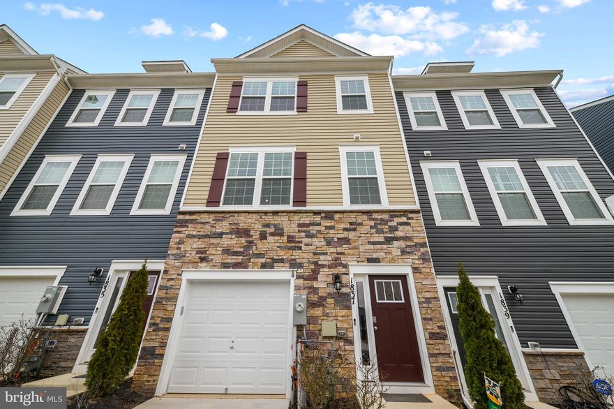 Luxurious, townhome with garage less than 2 years old in the newer Odenton Town Center community! Over 2,200 square feet on all three levels! Upgraded features throughout! Vinyl and stone siding! 9-ft. ceilings! Neutral decor throughout! Entry/Main Level spacious family room with recessed lighting and sliders to rear yard! Upper Level 1 features luxury vinyl plank flooring! Amazing, gourmet kitchen with 42-in cabinets, pantry, recessed lighting, stainless steel appliances, gas cooking,  granite countertops and tile backsplash! Oversized island with plenty of room for entertaining with pendant lighting! Separate dining area next to kitchen! Large living room with sliders to custom deck! Half bath with pedestal sink!  Upper level 2 includes huge primary bedroom with ceiling fan, walk-in closet, and additional shelving! Primary bath features a double sink, custom walk-in shower and ceramic tile flooring! Additional second and third bedrooms upstairs! Hall bath with granite vanity top, tub/shower combination and ceramic tile flooring!  Reinforced closets! Lots of natural light throughout! Why wait for new construction to be built? Easy access to Fort Meade, NSA, major highways, Marc station, BWI airport, trails, shopping, dining, Baltimore, Annapolis and DC! Immaculate inside and out!  Show and sell! A 10+++  Call Listing Agent for "Smart Home" features.
