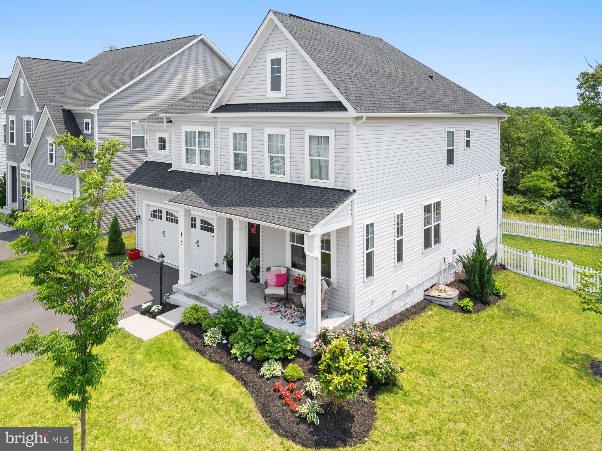 Discover Luxury Living in Snowden Bridge. Why build when this eye-catching curb appeal, charming Brookfield Sumner 4 Bd/ 3.5 Bath 2 car garage home with a 2 level bump out is built to Model Home Specs & Upgrades!! Approx $185k worth of upgrades at a very competitive sales price. (See separate special features sheet) This gorgeous home sits on a premium corner rear fenced lot backing to trees & woods.
An 8 zone Rain Bird Irrigation System has been installed in front, side and rear lawn areas. This lot is large enough for your future in ground pool and/or patio/deck. The Interior is approx 3969 Sq Ft of pure showcase delight. Open Floor Concept moves one gracefully from room to room. Luxury wide plank hardwood laminate flooring covers entire main for an impressive first glance. Note the upgraded Trim and 5 panel Door package, recessed lighting and 9' Ceilings throughout! Formal Living and Dining spaces create that designer touch interest. The Gourmet Kitchen hosts matching high end KitchenAid Stainless Steel Appliances, unique pendant lights that hang over the Carrara Marmi Quartz Center Island, a deep Stainless Steel sink & Creamy White Cabinetry. Convenient half bath nearby. The inviting Family Room just off the kitchen offers a cozy gas fireplace, remote controlled Hunter Douglas Blinds and upgraded ebony stained oak curved staircase to upper level. The cheerful Breakfast Room bump out is perfect for morning coffee, light family meals, game playing, reading or doing just necessary paperwork. On the upper level...the Primary Suite features a tray ceiling, same wide plank flooring, 2 his and her walk-in closets and an en-suite deluxe primary bath complete with large walk-in shower and soaking tub, separate water closet and dual vanities. 3 more Private Guest Bedrooms each with own walk-in closet; a full guest bath and laundry room and linen closet are offered just down the hall. The lower walk out level is carpeted and mostly finished with another decorative full bath and added game room bump out. There is additional space for a future 5th bedroom/den or office if needed otherwise what a great massive storage area.
For outdoor enthusiasts, impressive outdoor community pool, bike track, walking jog trails, basketball, tennis, volleyball courts, rec center etc.. are all included in the HOA dues.
Schedule today to tour 150 Jewel Box Dr. It's Time to own This Piece of paradise in Snowden Bridge!