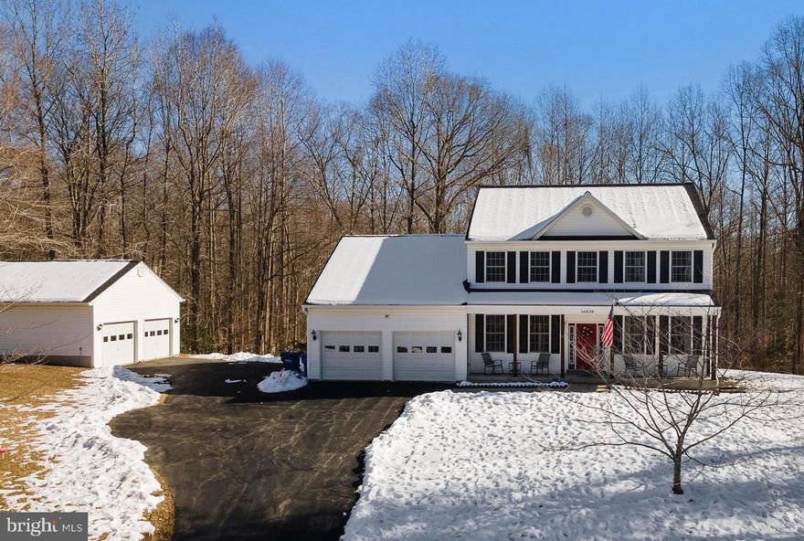Welcome to this stunning 5-bedroom, 3.5-bathroom colonial home nestled on a serene and private 3-acre lot in Brandywine, MD. Surrounded by lush trees, this property offers both tranquility and convenience. The expansive driveway leads to an attached 2-car garage and an additional detached 2-car garage, providing ample parking and storage options. Inside, the beautifully renovated main level boasts gleaming hardwood floors, a formal dining room perfect for entertaining, a spacious living room, and a cozy family room off the kitchen featuring a charming fireplace. The chef’s kitchen is a showstopper, complete with granite countertops, stainless steel appliances, and a generous island. A dedicated office and a convenient half bath complete the first floor. Upstairs, you’ll find four spacious bedrooms and two full bathrooms, including a luxurious primary suite with a soaking tub, separate shower, and plenty of closet space. Downstairs the basement has been completely finished to include an additional living room, bedroom, and full bathroom. Out back you'll find a brand new deck and stone patio, perfect for entertaining, as well as steps down to a picnic area and fire pit! This home combines modern elegance with peaceful seclusion – don’t miss your chance to make it yours!