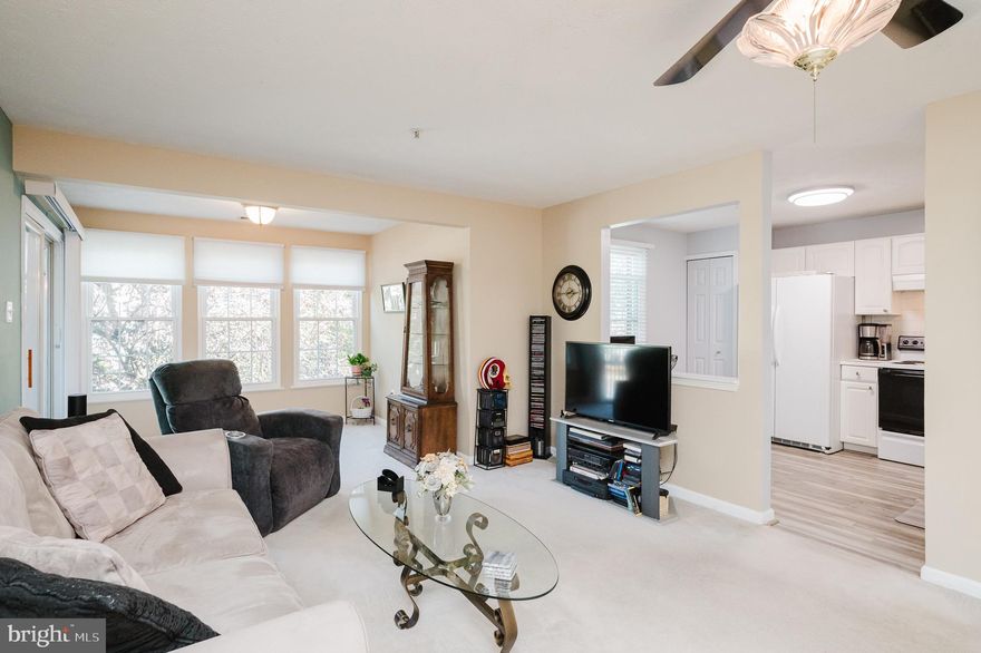 Welcome to 8001 Township Dr #201 — where comfort and convenience come together in this beautifully maintained 2-bedroom, 2- full bath condo. Step inside to find a bright, open layout with freshly painted walls and tasteful finishes throughout. The spacious primary suite features a generous walk-in closet and a beautifully tiled bath with a freshly regrouted shower. The kitchen shines with a tile backsplash, newer flooring, and updated appliances — including a dishwasher and refrigerator just a few years old. Enjoy morning coffee or evening sunsets in the sunroom or on your private balcony, complete with an extra storage closet. The building offers secure electronic entry and indoor mailboxes, while outdoors you’ll find ample well-lit parking and beautifully maintained common grounds. With a full laundry room, replacement windows under a lifetime transferable warranty, and all appliances included — this is truly easy, move-in-ready living!