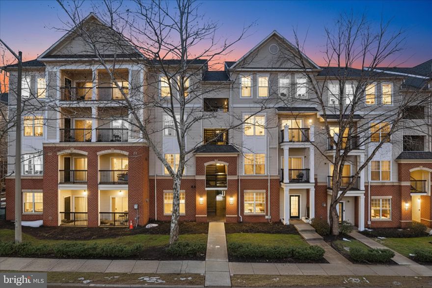 Come see this 2-bedroom, 2-bathroom home offering a thoughtfully designed layout with soaring ceilings, abundant natural light, and an open-concept living space anchored by a cozy gas fireplace! The kitchen is a standout, featuring granite countertops, stainless steel appliances, and gas cooking—perfect for both everyday meals and entertaining. The spacious primary suite includes stunning and updated en-suite bathroom with a walk-in shower featuring seamless glass and a stylish, oversized 2 sink vanity. The secondary bedroom has its own private updated bathroom, ideal for guests or a roommate setup.  Both bedrooms feature plenty of closet space!  Enjoy the convenience of an in-unit washer and dryer, plus a dedicated parking space  (space #286). A second parking space can be available through a lottery system. The private balcony offers the perfect spot to unwind at the end of the day. As a resident of Fairfax Ridge, you'll enjoy access to top-tier amenities including a community pool, fitness center, business center, clubhouse, playground, and beautifully maintained outdoor spaces. The location is unbeatable—close to the Vienna Metro, I-66, Route 50, and Route 29. You’re also just minutes from Fair Oaks Mall, Fairfax Corner, and the Mosaic District, offering endless options for dining, shopping, and entertainment. This home truly offers the perfect blend of comfort, convenience, and community. Don’t miss your chance to make it yours. Roof, windows, and balconies are the responsibility of the condo association