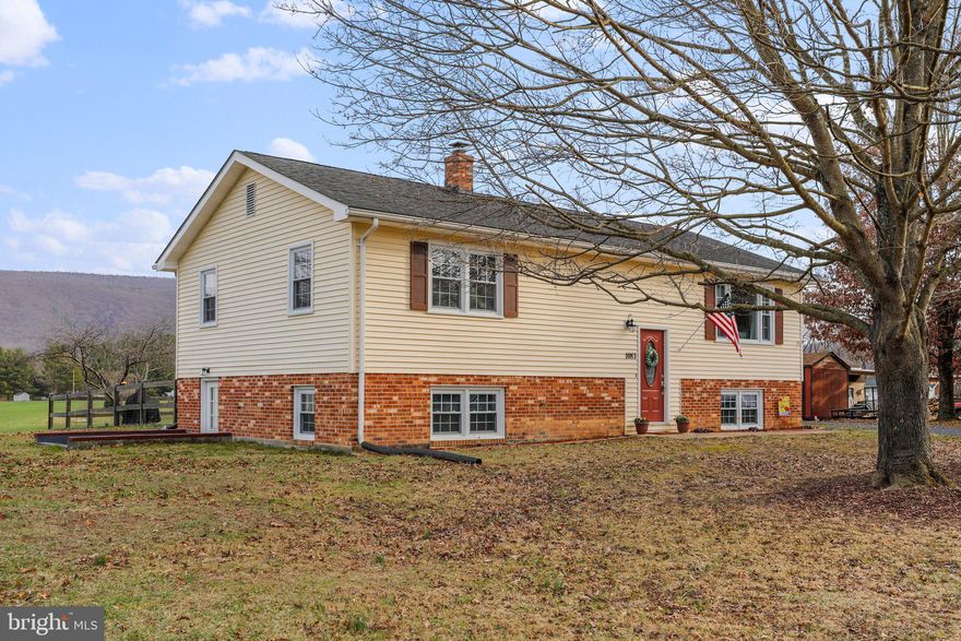 Escape to tranquility while maintaining easy access to urban conveniences with this exceptional renovated property. Located at 1083 Lakeview Dr. Woodstock, VA 22664, this idyllic 4-bedroom, 2-bath split foyer home is the epitome of rural charm without sacrificing proximity to essential amenities, including shops, restaurants, and local attractions.
Step into a thoughtfully designed open floor plan that seamlessly connects the living spaces, providing a warm and welcoming atmosphere. The lower level boasts an inviting office/bedroom, full bath, kitchenette and family room, offering versatile spaces to suit your lifestyle needs.
Situated on a sprawling 1/2 acre lot, this property ensures a sense of spaciousness and privacy. The partially fenced yard provides security without obstructing the breathtaking mountain views that surround the home. Whether you're enjoying a quiet evening on the new deck and patio area  or exploring the nearby countryside, this residence allows for relaxation without the feeling of isolation.
Recently updated, the kitchen features modern appliances, a stylish tile backsplash and refaced cabinets, creating a contemporary and functional space. New luxury vinyl plank flooring runs throughout the home, complemented by fresh paint, upgraded light fixtures, including recessed lighting and newly renovated tiled bathrooms.
Additionally, this property backs onto a picturesque farm, further enhancing the serene ambiance. If you're searching for a peaceful haven to call home, 1083 Lakeview Dr. is the answer you've been waiting for – a perfect blend of rural tranquility and modern comfort.
All sizes are approximate.