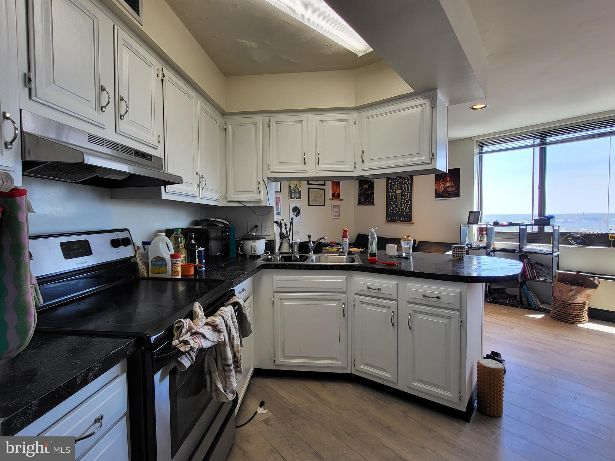 Light-filled junior one bedroom with southeast city vistas at Academy House! This well-appointed one bedroom features amazing natural light throughout. Enter into a sun-soaked and generously combined living and dining room with oversized windows. Open to the living room, there is a fully-equipped kitchen with ample cabinetry space, stainless steel appliances, and a breakfast bar. The bedroom enjoys excellent closet space and use of a nearby full hall bathroom with a updated vanity, tub shower, and marble tile floor. There are vinyl floors throughout. Residents of Academy House enjoy a 24-hour doorman and a state-of-the-art fitness and aquatic center. There is valet parking in the building's garage for an additional monthly fee, subject to availability. The Academy House is located in the heart of Center City and within close walking distance to Rittenhouse Square, Washington Square, and the Broad Street and Market Street office corridors. The Philadelphia International Airport and Amtrak's 30th Street Station are easily accessible.