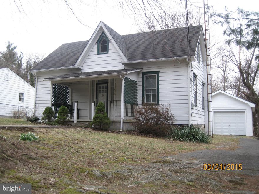 Historic Property once owned by Storer College president. Cottage charm exudes throughout this lovingly restored home. All the work has been done for you, move right in! Possibilities with rooms, could have 3-4 bedrooms or family room. Stately trees grace the lot, berry bushes abound, private setting backs to Park land, near Marc Train & MD. Detached garage w/ workshop completes this unique home.