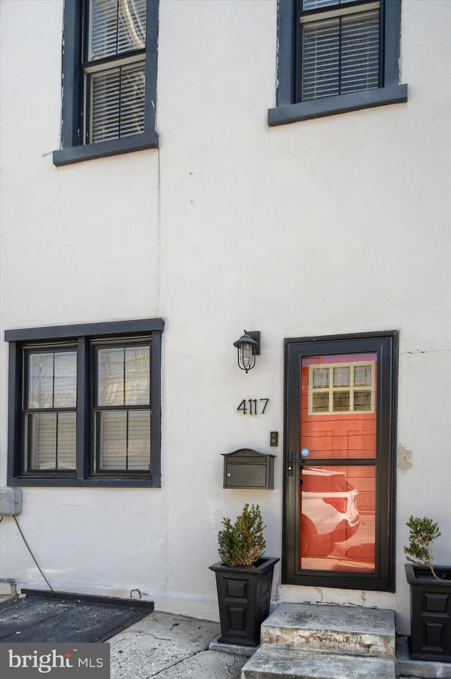 Just steps from Main Street in Manayunk, this home  was fully renovated in 2020.  The main level features high ceilings, hardwood floors, and an expanded living area that creates an open, airy feel.  Modern kitchen includes a large island, generous cabinetry & ample space for both cooking and casual dining. A half bath, laundry area, and wet bar lead to a backyard which is ideal for outdoor entertaining. Upstairs, the primary suite offers a walk-in closet w/ Sliding Barn doors and a bath with double sinks & a walk-in shower. Additional bedrooms are spacious and filled with natural light.  The third floor provides flexible living space can be used as 4th bedroom or Office. Renovations made use of Alleyway which gives the Living Room a Larger Floor Plan. There are 4 years left on Tax Abatement.  In Addition to the Fantastic closet space, this home's basement provides Ample Storage. Enjoy all that Manayunk has to offer; Restaurants, Shopping & close to Center City Philly.