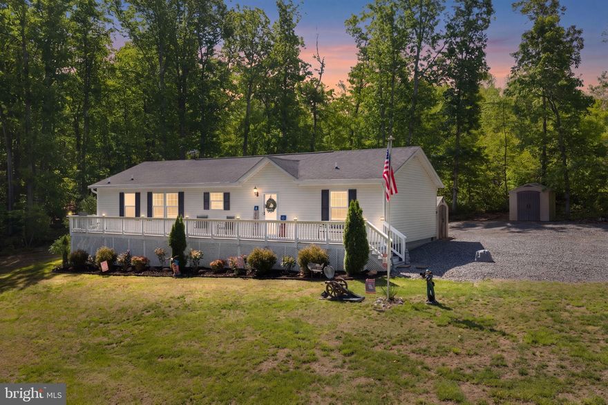 Charming Lake House on Public Side of Lake Anna! 3 Bed/2 Full Bath, 1500 sq ft on 1.61 Acres that backs to private wooded setting. Open Floor Plan, Front Porch, Back Patio, Deep Water Boat Slip and More!!! This beautiful community is golf cart friendly and an excellent location both by land & lake. This is an incredible opportunity to enjoy your own slice of heaven - perfect as a full-time residence or weekend getaway. A short golf cart ride — approximately 0.1 miles —to your waterfront common area's boat ramp, fire pit, gazebo, picnic area, sunning area and swimming. End your perfect lake day on your own private patio in your back yard.  Imagine dinner in the gazebo and a bonfire under the stars. Close to Food Lion, Restaurants, Brewery, and More!