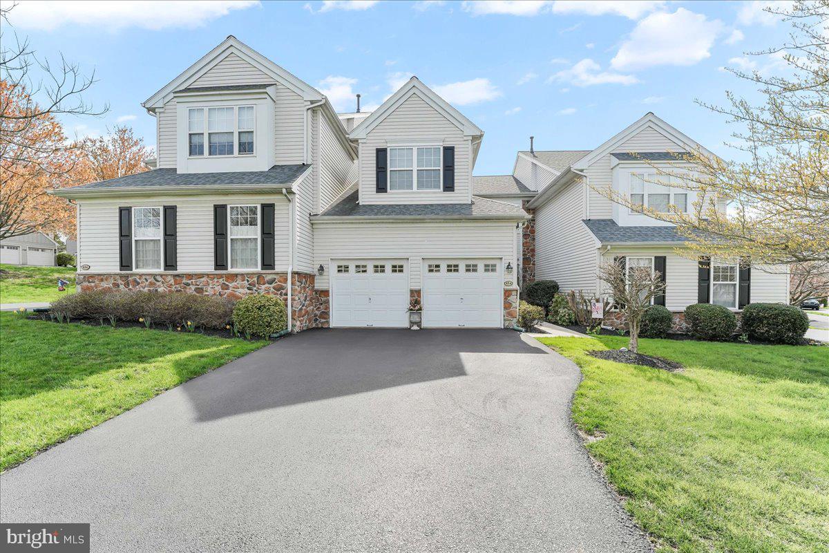 Welcome to 854 Hinchley Run, a beautifully updated and meticulously maintained 3-bedroom, 2.5-bathroom home nestled in the tranquil Green Lane Village community of West Chester. This colonial-style townhouse offers 3,110 square feet of living space, providing ample room for comfortable living and entertaining. As you approach the property, you'll be greeted by a beautifully landscaped front entry and a spacious driveway with plenty of parking. The attached two-car garage adds convenience and additional storage space. Upon entering, the foyer leads into a spacious living room featuring a new dual-sided gas fireplace, creating a warm and inviting atmosphere. Adjacent to the living room is the dining room, offering plenty of space to host holiday meals and gatherings. The kitchen is a chef's delight, equipped with spacious cabinets, granite countertops, stainless steel appliances, and an island with seating—perfect for entertaining or enjoying a quick meal. The breakfast area, bathed in natural light from surrounding windows, provides a serene spot for morning coffee. The cozy family room, located just off the kitchen, is ideal for relaxing and watching your favorite shows, with access to the private back deck for outdoor enjoyment. A conveniently located half bath completes the main level. Upstairs, the primary bedroom suite is accessed through double doors and boasts a vaulted ceiling that emphasizes the generous size of the room. The suite includes two walk-in closets and a beautifully updated en-suite bath featuring a quality KraftMaid vanity with a floor-to-ceiling linen cabinet, dual sinks, attractive tile floors, and a glass-enclosed shower. Two additional spacious bedrooms, an updated full hall bath, and a laundry area complete the upper level. The finished basement offers two versatile living spaces that can be customized to suit your needs—whether as a home gym, office, library, or media room. Additionally, there are two unfinished storage areas providing ample space for organization. Recent updates to the home include a new HVAC system (2020), roof (2021), and hot water heater (2024). The interior has been freshly painted, and new carpeting has been installed in the living room, primary and secondary bedrooms, and stairs. The kitchen island has been enhanced with newly installed wainscoting panels, adding a touch of elegance. Located within minutes of various shops and restaurants along West Chester Pike and just a short drive from the popular West Chester Borough, this home offers both tranquility and convenience. Don't miss the opportunity to make this exceptional property your own. Schedule your private tour today!