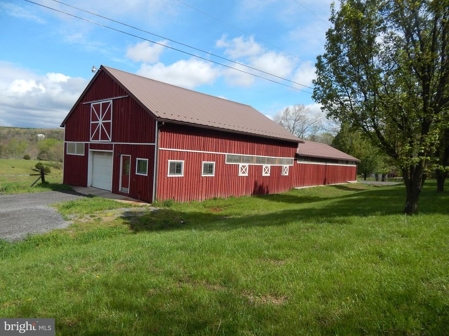 22.127  Acres  with Pasture and Mountain Views, perfect for Horses.   619'  frontage on the Sleepy Creek. Barn tack room is plumbed for a sink, 9 stalls inside and 2 stalls outside.  One end of the barn is 36 x 46 with  tack room that is plumbed for a sink, 7 stalls, ranging from 9 x 12 up to 10 x 12.    Plus,  steps to storage area on the second floor.  Other end  is  30 x 52 with 2 large stalls (7 x 13 and 7 x 36) plus 2 outside stalls.   Barn is a total of  3100 s.f.  Well on the property with several dry hydrants in the fields, pond, perced for septic, and recently surveyed.   Looking to get back to nature?  Perfect land for your own farmette.   Doublewides, horses, cows and chickens allowed.  Seller will add 3 deed restrictions.