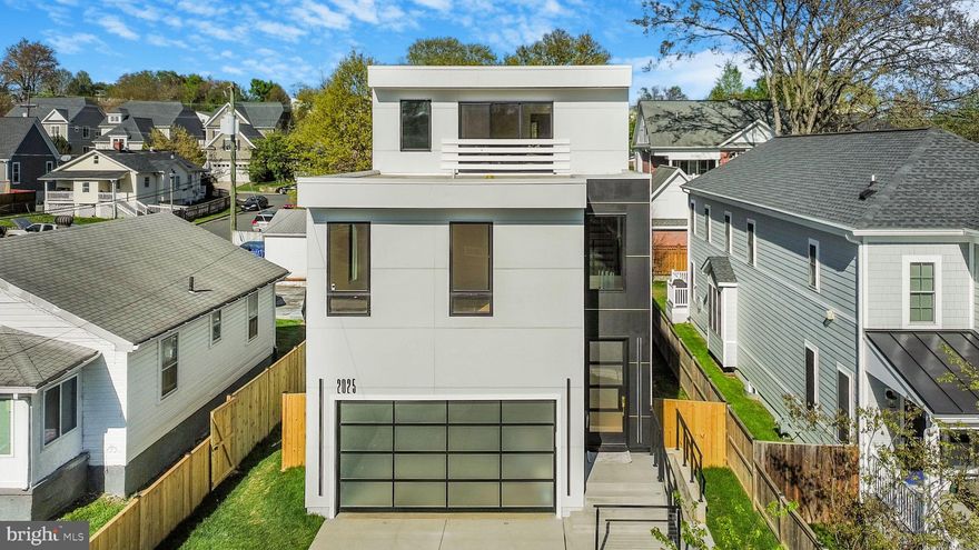 Welcome to this exceptional Organic Modern New Construction Home in the heart of Arlington, Virginia, where sleek design meets luxury living. Spanning an impressive 5,135 sq ft total, this modern contemporary residence is thoughtfully crafted with Luxurious finishes and cutting-edge features throughout.

As you approach, the exterior features Hardie Panel siding, wifi-enabled modern glass garage door, and an illuminated driveway set the stage for the sophistication inside. Step through the extra-large Marvin Casement doors into a space defined by tall ceilings, floating white oak stairs, and maple hardwood floors. The open-concept living area is anchored by a stunning waterfall island in the gourmet kitchen featuring top-of-the-line appliances, 2-inch Miter Countertops, and a butler's pantry. The fireplace and LED lighting add warmth and ambiance, while the stainless steel cable railings and composite decking extend the modern style outdoors.

This home boasts 5 spacious bedrooms, 4.5 luxurious bathrooms, and an office. Each room is equipped with an internet jack for seamless connectivity. The primary suite offers a large walk-in closet and a spa-like bathroom with a stone bathtub and Kohler and Hansgrohe fixtures. Enjoy the convenience of two laundry rooms with an all-in-one washer and dryer.

The fully finished basement with wall-to-wall porcelain tiles features a walkout entrance, a wet bar, a kitchenette/coffee bar, and a large entertainment space. Outdoors, the fenced backyard, extra-large patio doors, and composite deck create the perfect setting for relaxation and entertaining.

This home is built for efficiency and comfort with a tankless water heater, gas furnace heat, and air-forced A/C. Additional features include ceiling fan options, stone bathtubs, large porcelain tiles on city water, and public trash services. The seller is willing to install a rooftop deck, with a full-price offer!

Experience modern living at its finest — schedule your private tour today!