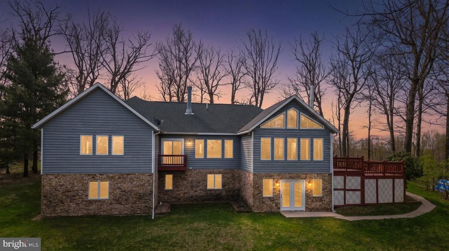 Perched atop Sunset Ridge on a rare double lot, this exceptional 5-bedroom, 4.5-bath cedar-sided, craftsman-style rancher offers sweeping panoramic views and an unbeatable location just minutes from State Parks, Wisp Resort, and Deep Creek Lake!

This beautifully maintained home offers a rare blend of timeless elegance and comfortable living, thoughtfully designed to appeal to today’s discerning buyer. From the moment you enter, you are welcomed by a sense of warmth and understated sophistication.

Throughout the home, Martha Washington–inspired paint colors create a cohesive and inviting backdrop. These soft, muted tones—rooted in classic historical palettes—bring a sense of calm and refinement to every room. As natural light fills the spaces, the colors gently evolve throughout the day, adding depth, dimension, and a subtle richness that enhances the home’s character.

The interior flows with ease, offering both gracious gathering spaces and quiet retreats. Each room feels intentional yet effortlessly livable, making the home equally suited for entertaining guests or enjoying peaceful everyday moments.

Attention to detail and pride of ownership are evident throughout, creating a property that feels both well cared for and move-in ready. The overall aesthetic strikes a perfect balance between classic beauty and modern comfort, allowing buyers to envision their own style while appreciating the home’s enduring design.

Set in an elevated, private setting, the property delivers both tranquility and easy access to four-season recreation. Includes Lot 40, a 1.05-acre adjoining parcel, creating a total of approximately 2.10 acres, providing added space, flexibility, and long-term potential.

A rare combination of stunning views, proximity to amenities, and mountaintop acreage—this is a must-see for anyone looking for their piece of Garrett County. Call today to schedule your private showing!