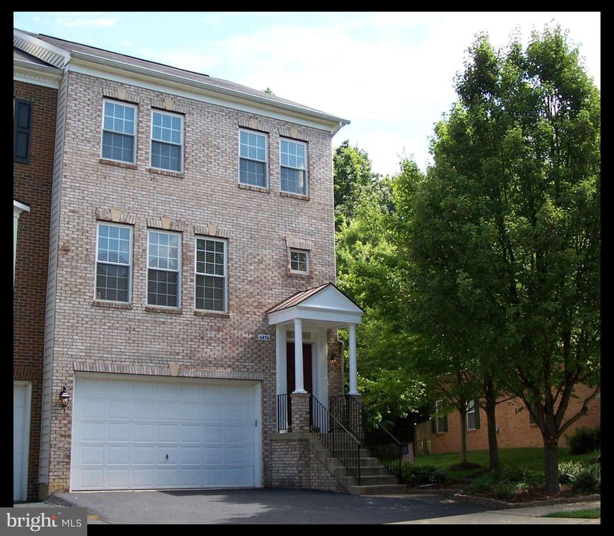 Grand 24' brick front end unit on premium lot backs to wooded common area,  hardwoods on main, open kitchen w/ granite and GE Cafe s/s, 9' ceilings through out. Master BR w/ tray ceiling, walk-in closet and spacious bath w/ separate tub & shower, Large Trex deck overlooks lush green trees. 2 car garage & fenced backyard, close to Wegmans, Jeff Todd Way, Fort Belvoir, Springfield.Island Creek Elem.