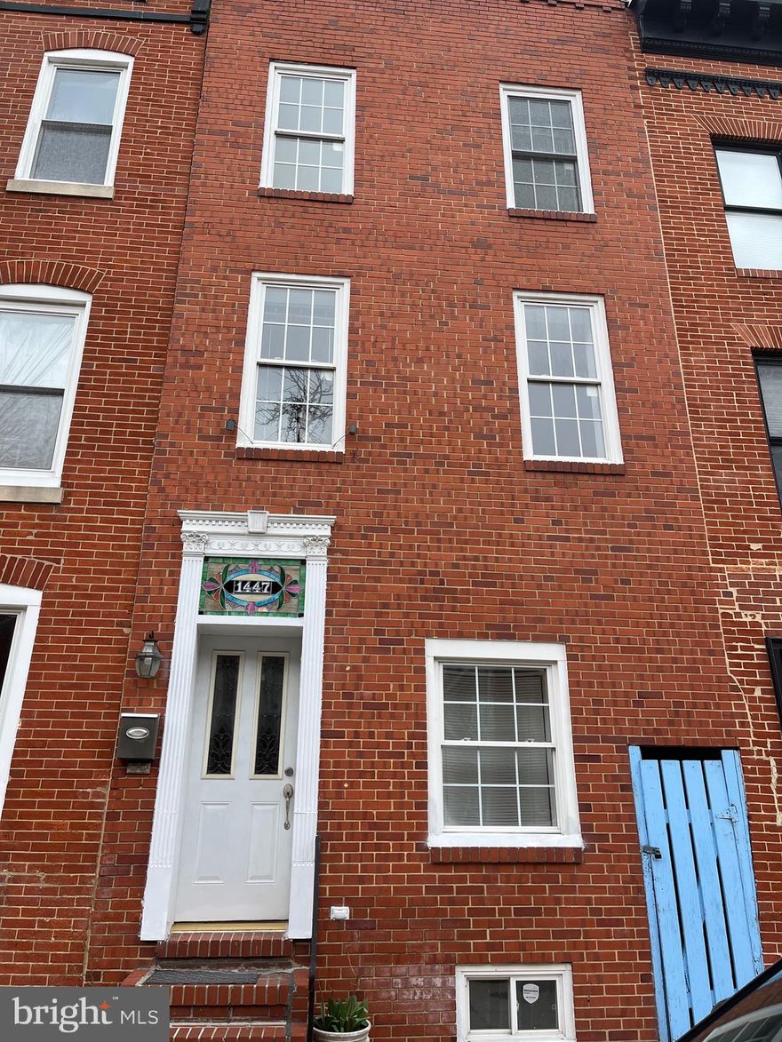 Located in the desirable Riverside/Federal Hill area of Baltimore, 1447 William Street is a spacious multi-unit brick townhome offering exceptional flexibility for investors or owner-occupants. This approximately 3,400+ square foot property features two separately metered units with the potential to add a third income-producing unit, creating strong rental and house-hacking opportunities. The main-level unit offers a comfortable 1-bedroom, 1-bath layout with an open living and dining area, while the upper levels include a larger multi-bedroom residence with an updated kitchen, generous living spaces, and a primary suite with a walk-in closet and ensuite bath. Highlights include hardwood floors, exposed brick accents, tall ceilings, in-unit laundry, and rear alley access with additional space that could be converted to another rental or garage. Situated just minutes from the Inner Harbor, Locust Point, and the vibrant restaurants and nightlife of Federal Hill, this versatile property presents excellent potential for both cash flow and long-term appreciation