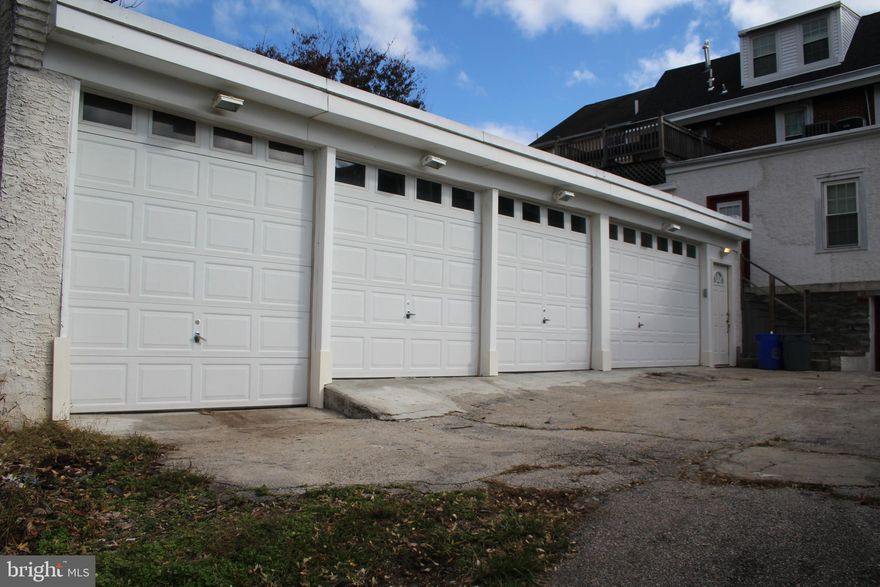 Very large garage for rent with 5 bays for parking or storage. One space has a double door, the 3 others are single doors. Clean and freshly painted, electric and water on site. Great space for storing vehicles or other items.