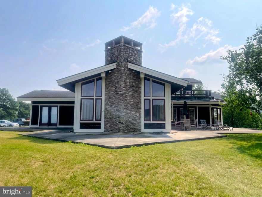 Nestled at the end of a private drive in Landingville, 76 Zehner Lane is a 6,000-square-foot architectural masterpiece modeled after the iconic organic style of Frank Lloyd Wright. This expansive estate of 93 acres offers total seclusion, designed with floor-to-ceiling vistas that invite the outdoors in and create a seamless connection with the surrounding landscape. As a true sanctuary for nature lovers, the property is a frequent corridor for local wildlife, offering a rare opportunity to live in a functional work of art where modern luxury meets the untamed beauty of the Pennsylvania woods.