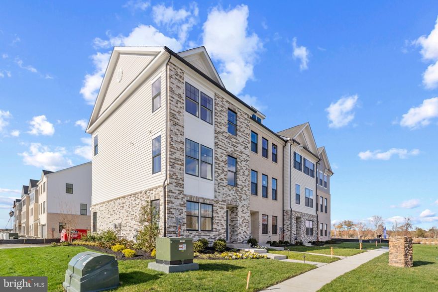 This 3-story open and contemporary end unit floorplan encompasses 4 bedrooms, 3.5 baths, and a 2-car garage. Thoughtful design and modern luxury are uniquely embodied in this townhome plan, which features 1,763 sq ft of living space. The Norris offers a spacious main level eat-in kitchen with recessed lighting, and a generous island providing plenty of cooking and entertaining space. The upper level boasts a private laundry closet and stylish primary bedroom, complete with a walk-in closet and dual vanities. The lower level features a finished recreation room that can double as a 4th guest suite.  With black windows and a black garage, the curb appeal of this home boasts an urban and modern feel that is sure to stand out.