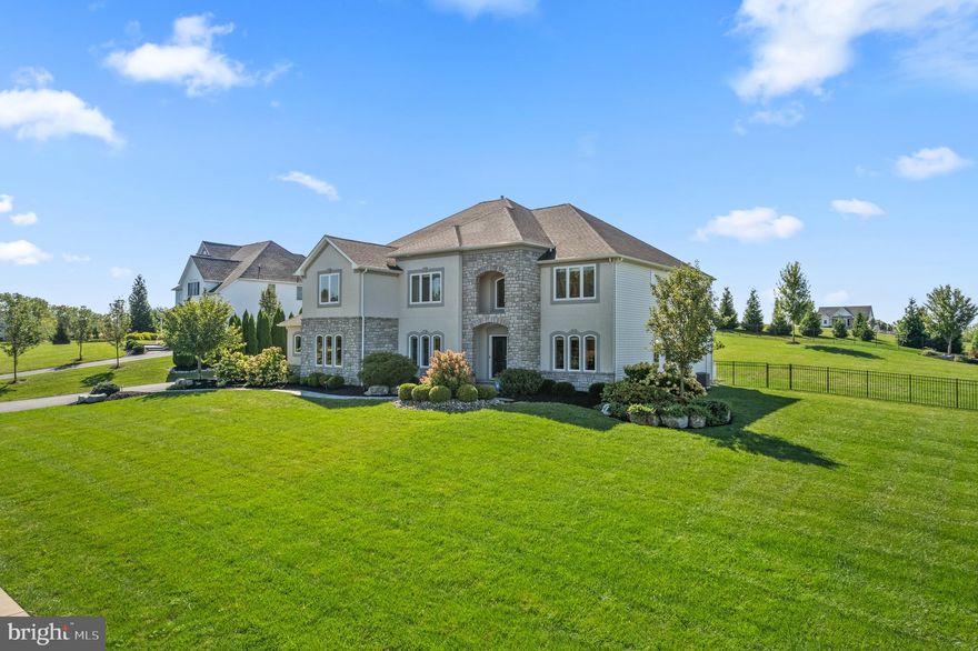 This stunning 2018 Tuskes home offers over 4,000 sq ft of beautifully designed living space where luxury, comfort, and thoughtful craftsmanship come together. From the moment you enter, you’ll appreciate the attention to detail and the seamless flow perfect for everyday living and entertaining. The expanded gourmet kitchen serves as a true centerpiece, featuring a Wolf stove, double oven, Sub-Zero refrigerator, wine fridge, Cove dishwasher, oversized Quartz island, and walk-in pantry, an ideal space for cooking and connecting with loved ones. Open to the kitchen, the two-story family room offers coffered ceilings, a stacked-stone gas fireplace, built-in Sonos speakers, and a rear staircase that enhances the home’s welcoming layout. A formal dining room sets the stage for holidays and memorable gatherings. The first floor also includes a private office with French doors and a convenient bedroom with a full bath — perfect for guests or flexible living needs. Upstairs, the oversized primary suite feels like a retreat with generous space and a serene atmosphere. Every bedroom has access to its own bathroom, including a Jack-and-Jill, providing comfort and privacy for all. The finished lower level shines with a custom bar featuring Sub-Zero & Cove appliances, refrigerator drawers, a Sub-Zero wine cooler, Cove dishwasher, and a dedicated ice maker, creating the perfect space to unwind or host. A rare opportunity to own a beautifully crafted residence designed for today’s lifestyle.