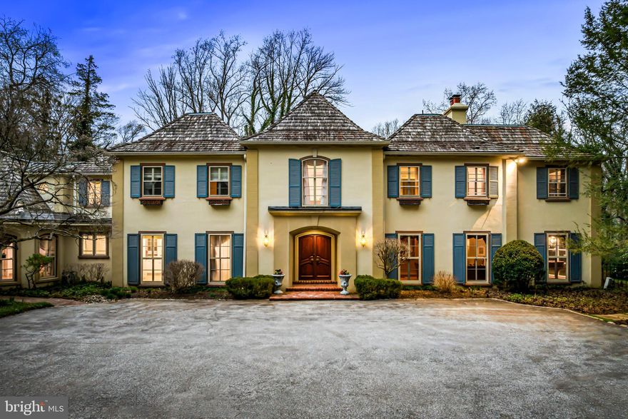 Showings begin 4/3.
Majestically set back through it's impressive gated entrance is this stunning French manor home, surrounded by 2.3 acres of complete privacy, beautiful gardens, a stunning  pool with spa, and fully permitted lit tennis court space. Designed by Perc Kennedy and built by Thomas McCloskey, this is a rare find in Lower Merion, close to renowned schools, clubs, trains, world class shopping, restaurants, Center City Philadelphia and just 90 minutes from New York City. Look no further and enjoy this spacious floorplan offering over 10,000 square feet of highly sought after living spaces including sun-filled windows, stunning plaster walls and crown moldings, gracious Living and Dining Rooms, 3 fireplaces, a richly paneled Library, expansive white gourmet kitchen opening up to a sun-filled breakfast room and family room with soaring ceilings. additional first floor office space, a first floor guest suite with full bath, luxurious primary bedroom suite,  4 additional bedroom suites with 3 additional full baths, including a private guest or Au-Pair suite, a lower Level gym or wine tasting room and more. Move right in!