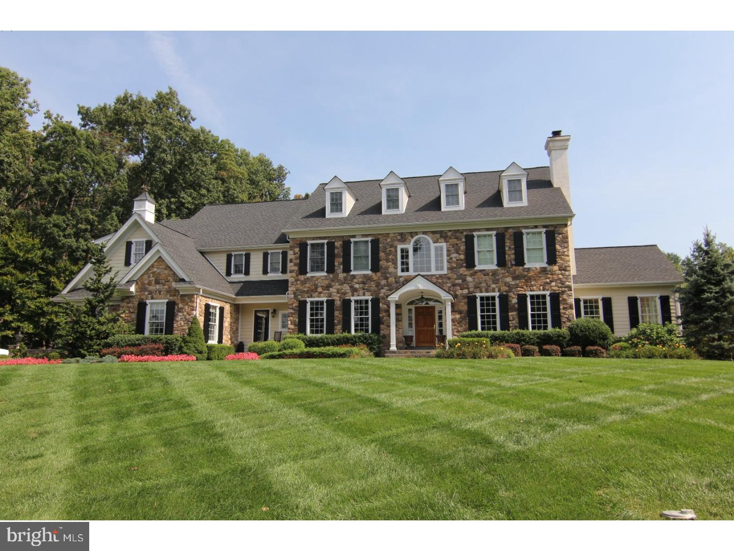 Completely updated Custom Luxury Home built of the finest quality & materials with stunning details at every turn! The appeal begins outdoors, located on over 2 acres of manicured landscaped lawn with bluestone patios and walkways, lighting, covered porch and separate area with heated pool & spa. Upon entering the delightful features continue at the 2 story entry with traditional oak staircase and oversized rails, which extends to the back of the house permitting the natural light to flow throughout. At the heart of the home is the grand brand new gourmet chef's Kitchen allowing for wonderful flow with its openness to the Gathering Room and large Breakfast Room. Notable interior features are: 9"ft. ceilings, all refinished hardwood floors, freshly neutral paint throughout, 2 custom gas fireplaces, Conservatory with vaulted beamed ceiling & walls of windows, hardwood floors, brick floor in the Mud Room, crown molding & chair rails, raised panel wainscoting, First fl Office with built-in cabinetry and many more custom and high end finishes. The walk out lower level is strikingly unique and looks right out of a magazine with a cafe area, media space, billiard room, home gym and full Bath with finishes such as, brick, hardi plank siding, tile, standing seam roof and cafe awning. On the 2nd floor there are 2 Bedrooms that share a Newly Updated Bath, a Bedroom with Updated Bath with Hall access, an additional oversized room, Laundry Room and a Main Suite with tray ceiling, 2 walk-in closets and luxurious updated Bath. With over 8,000 sq. ft. of living space, this superb Home should be experienced to appreciate all it has to offer!