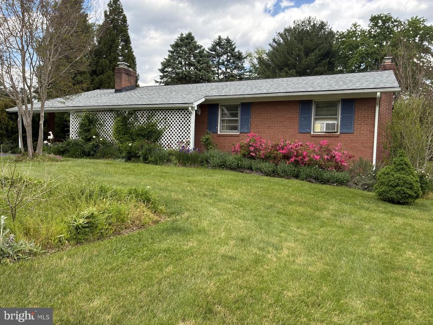 New Price! Brick Rancher with 3 BR, 1 1/2 Bath on Lovely Landscaped Lot. Simplicity of 1 Floor Living.  Hardwood Floors on main level. Stackable Washer and Dryer in Kitchen. Gas Fireplace . 3 Spacious Bedrooms.  Lower level has lots of storage. Recently updated roof.  Duct work in attic for central air.  Carport currently being used as a patio.  Beautiful Gardens with an abundance of Flowers that bloom from Spring to Fall.  Large Shed For all of  your Gardening Supplies!!  Being Sold AS IS!  Sellers are still packing.  Close to shopping , restaurants, parks and commuter Routes. Close to downtown Frederick!  Home Warranty! 24 Hour Notice! The Flowers are Blooming!!